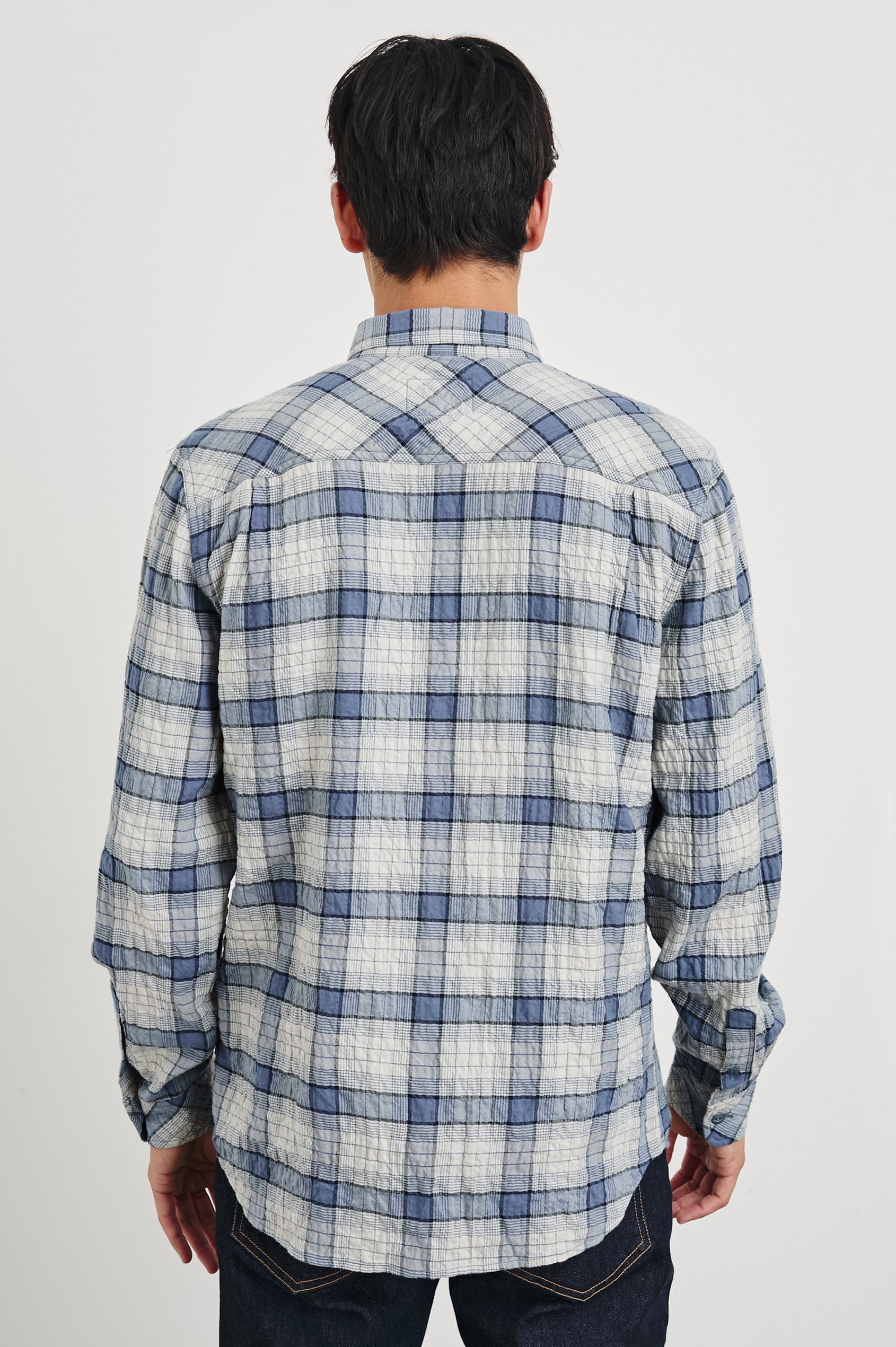 Powell Long-Sleeve Button Up with Textured Cotton and Two Chest Buttoned Flap Pockets in Paper Iris Colorway, a white and blue plaid - Back View Featured on Model