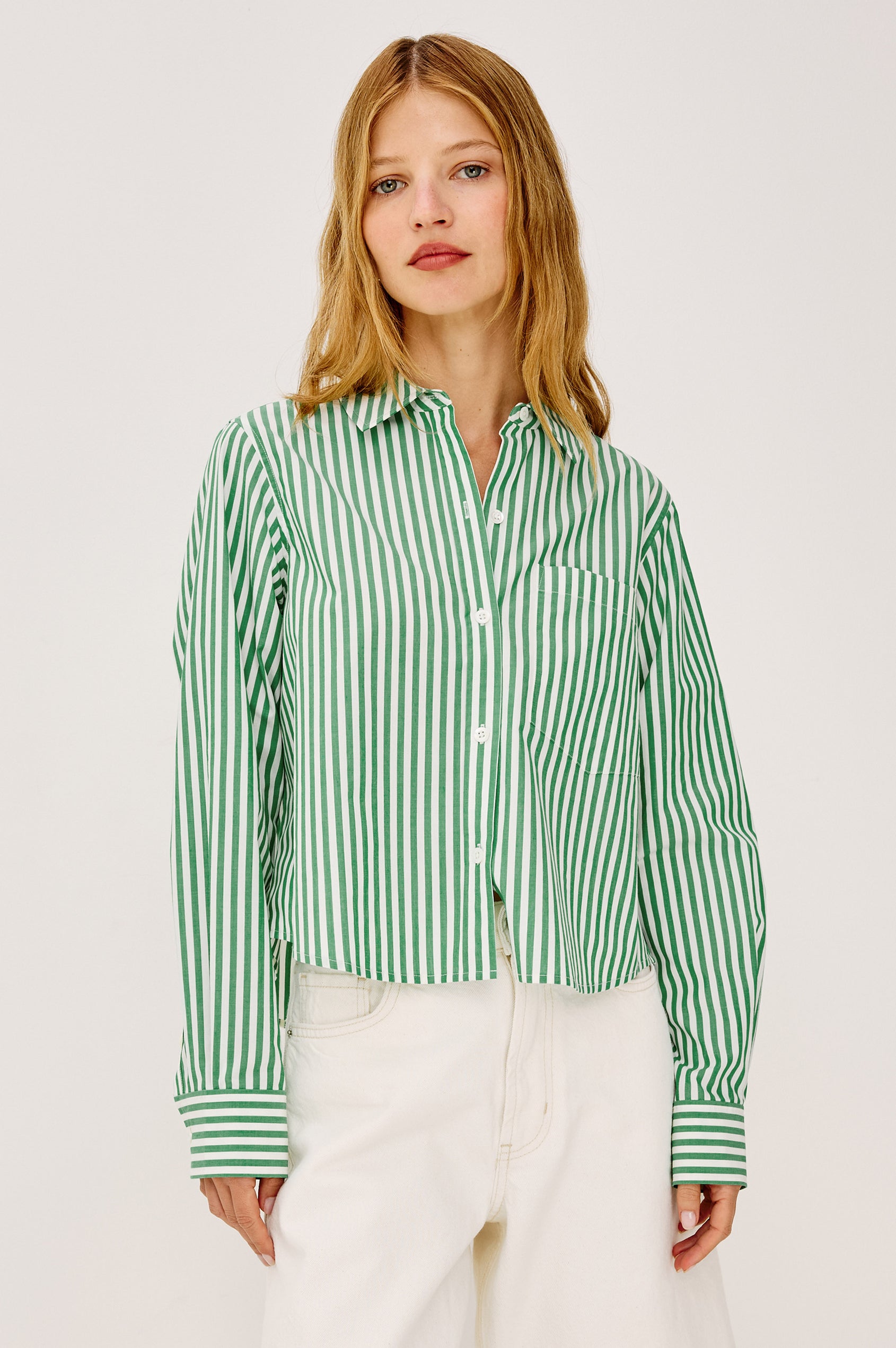 Ramy Crop Shirt in Cotton Poplin With Button-Up Placket, Collar, Chest Patch Pocket, Long Sleeves, and a Loose, Boxy Fit in Emerald Stripe Colorway - Upper Body Front View Featured on Model