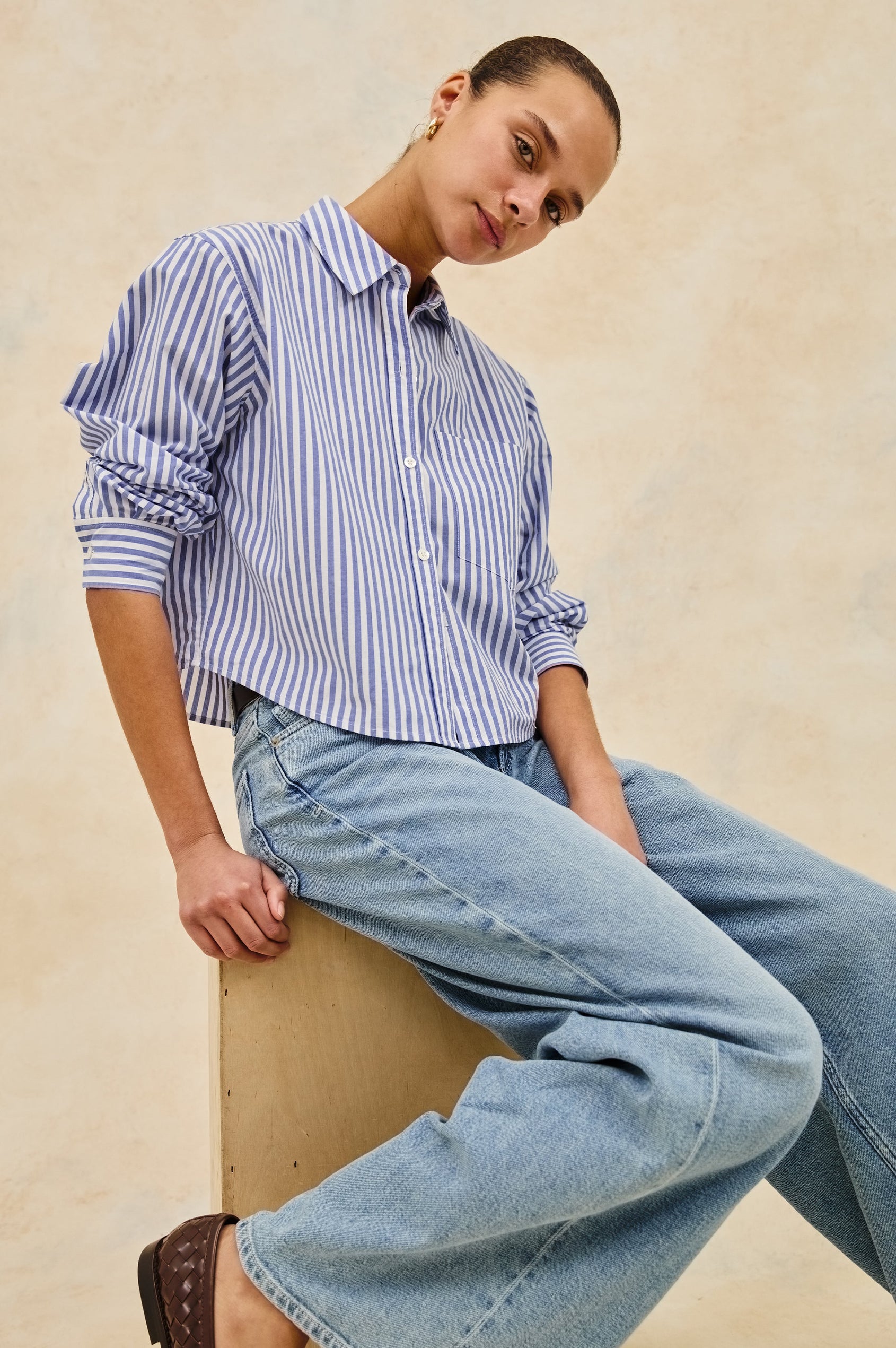 Ramy Long Sleeve Poplin Cotton Shirt With Shortened Hem In Colorway Mariner White Stripe - stylized front view on model sitting down