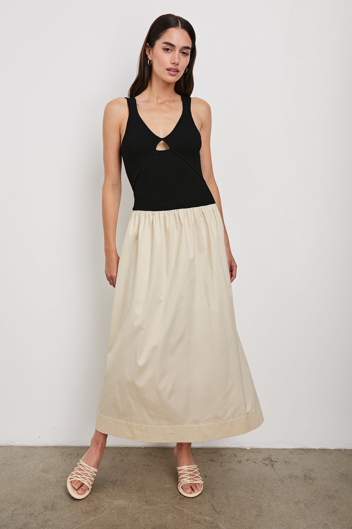 Raquel Maxi Dress with Straps, a Scoop Neckline with Keyhole and Pleats at Waistline in Black Ivory Colorway - full body front view on model, in motion