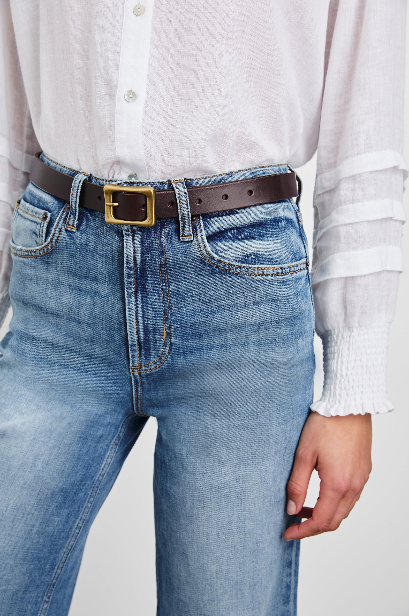 Remi Belt with a Rectangular Buckle with Rounded Corners in Brown Gold Colorway, Brown Belt and Gold-Tone Buckle - Front View Featured on Model