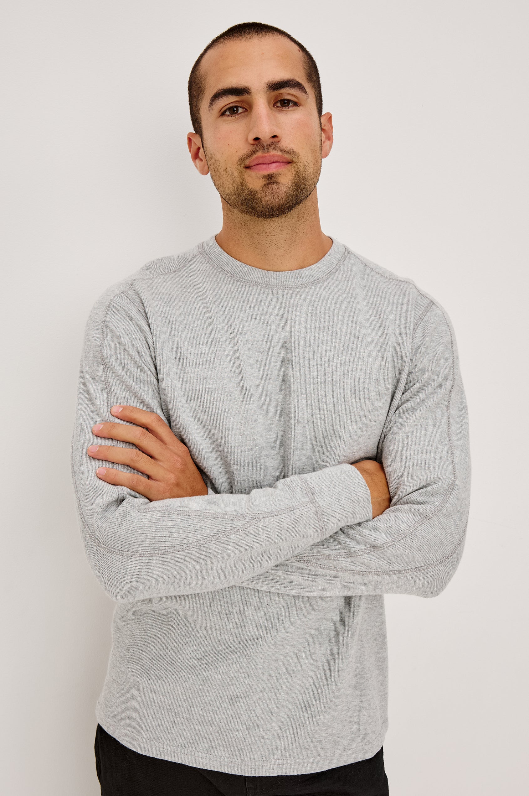 Rheese Long Sleeve Tee in French Rib Cotton With Crew Neckline, Classic Fit, and Seam Detailing in Grey Heather Colorway - Upper Body Front View Featured on Model