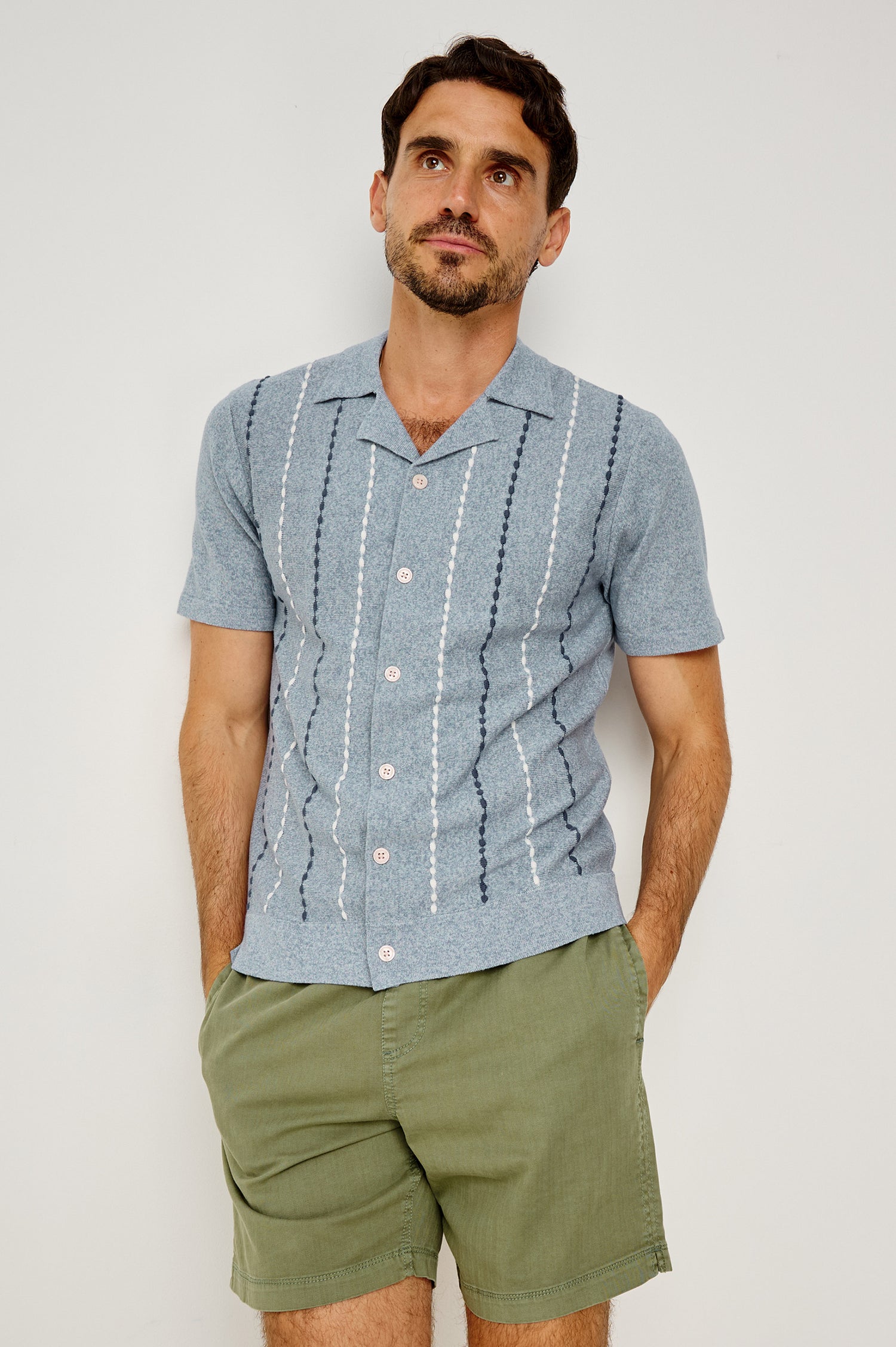 Richie Polo Shirt in Cotton Blend Knit With Collar, Front Buttons, Short Sleeves, and Classic Fit in Navy White Sky Colorway - Upper Body Front View Featured on Model