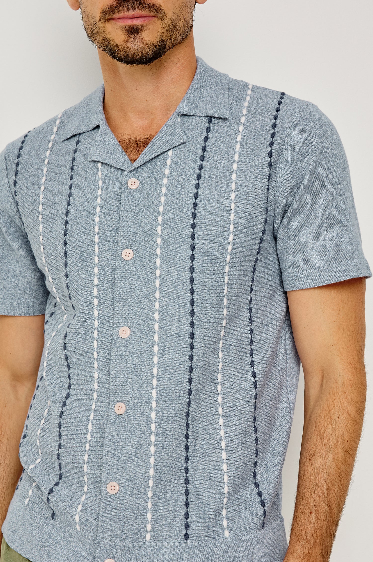 Richie Polo Shirt in Cotton Blend Knit With Collar, Front Buttons, Short Sleeves, and Classic Fit in Navy White Sky Colorway - Upper Body Front View Featured on Model