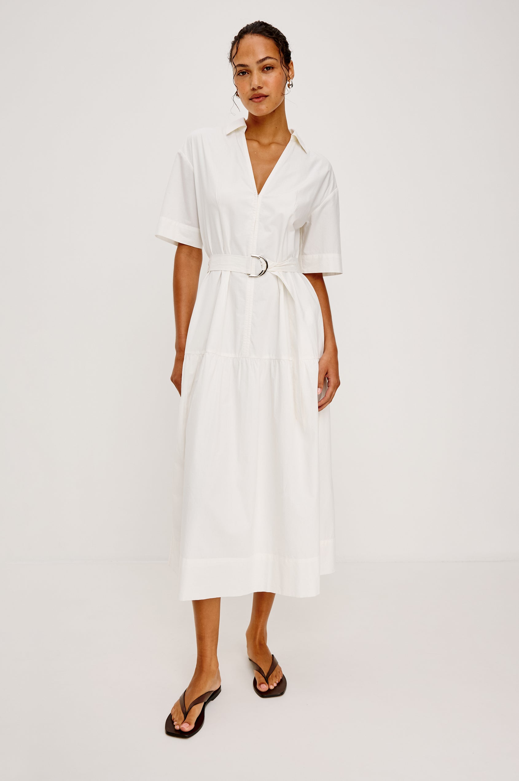 Richmond Midi Dress in Cotton With Collar Front Button Placket Side Pockets D-Ring Waist Belt Short Sleeves and Relaxed Fit in White Colorway - Full Body Front View Featured on Model