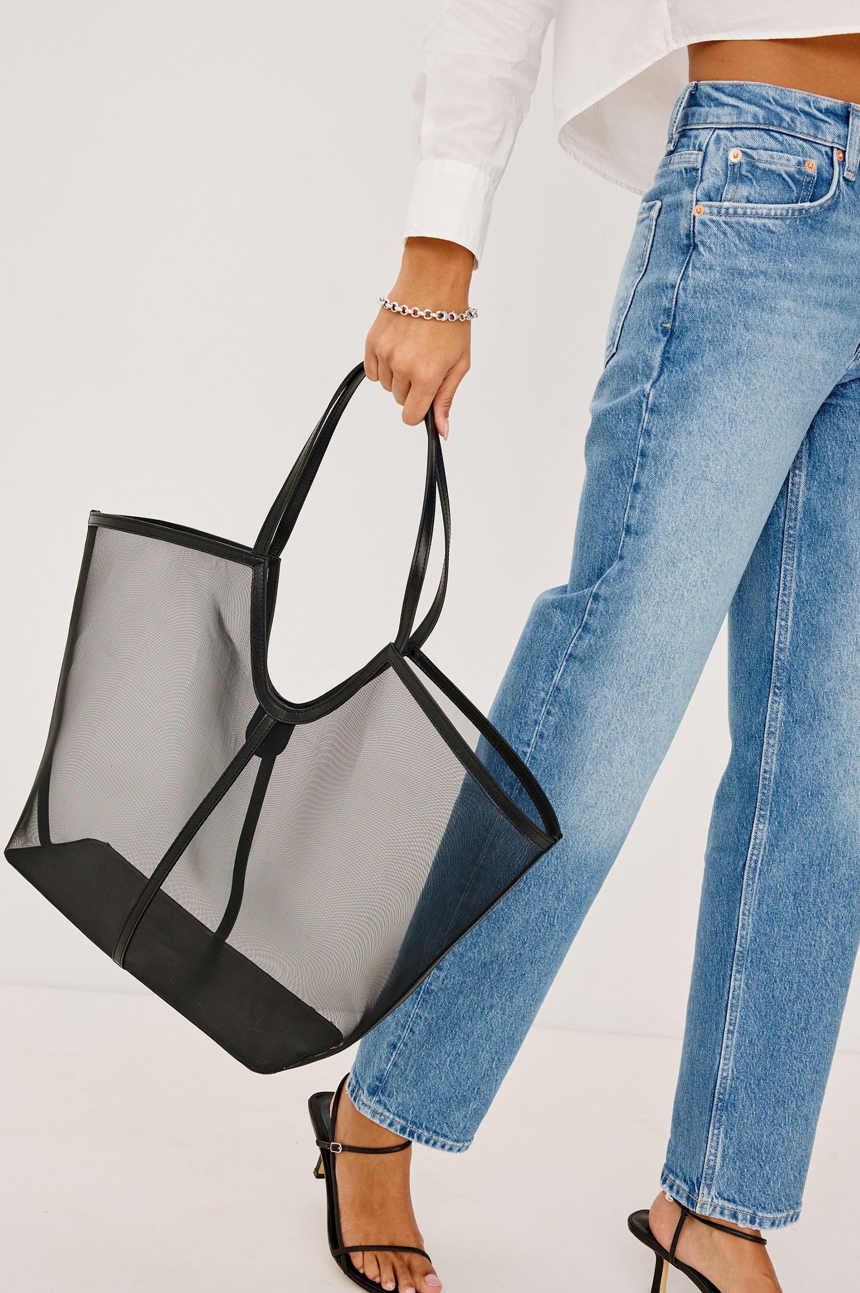 Roma Tote in Mesh With Spacious Trapeze Shape, Leather Trim, and Top Handles in Black Colorway - Side View Featured