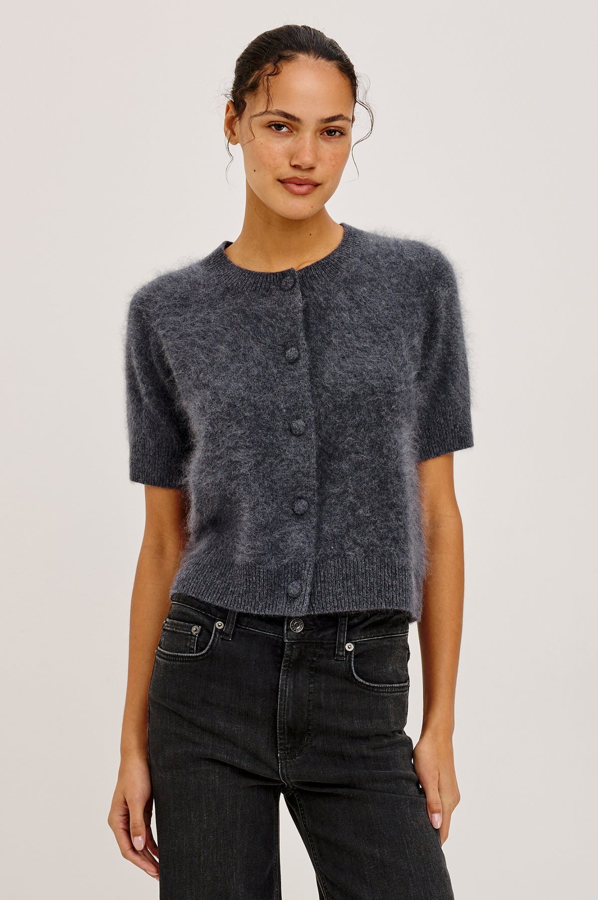 Roman Cardigan Sweater in Brushed Wool With Fluffy Feel With Slightly Cropped Fit, Crew Neck, Self-Covered Front Buttons, Short Sleeves, and Ribbed Trim in Charcoal Colorway - Upper Body Front View Featured on Model