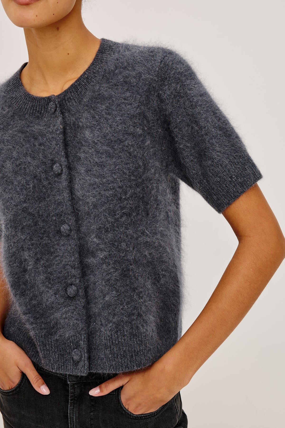 Roman Cardigan Sweater in Brushed Wool With Fluffy Feel With Slightly Cropped Fit, Crew Neck, Self-Covered Front Buttons, Short Sleeves, and Ribbed Trim in Charcoal Colorway - Upper Body Front View Featured on Model