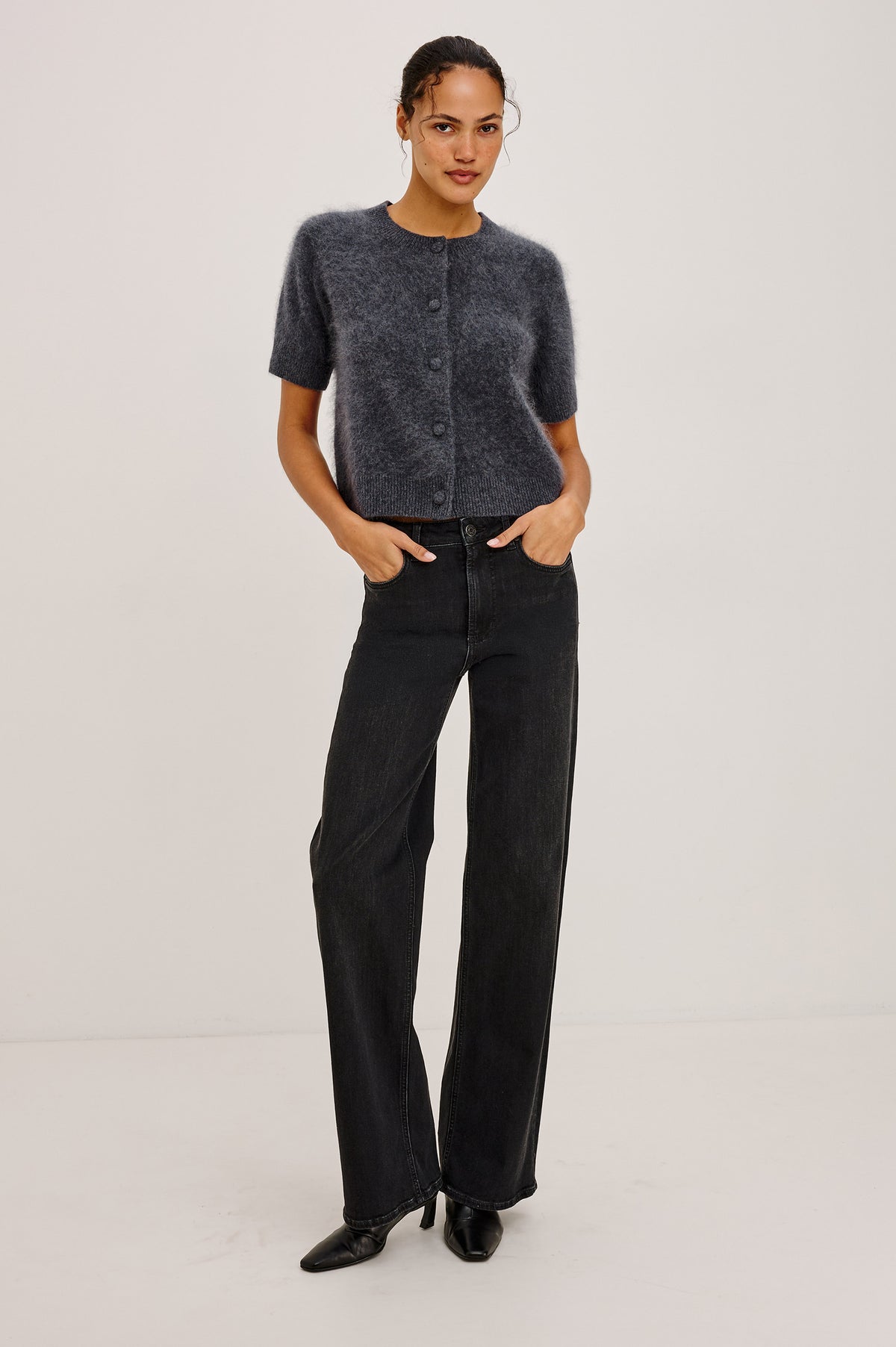 Roman Cardigan Sweater in Brushed Wool With Fluffy Feel With Slightly Cropped Fit, Crew Neck, Self-Covered Front Buttons, Short Sleeves, and Ribbed Trim in Charcoal Colorway - Full Body Front View Featured on Model