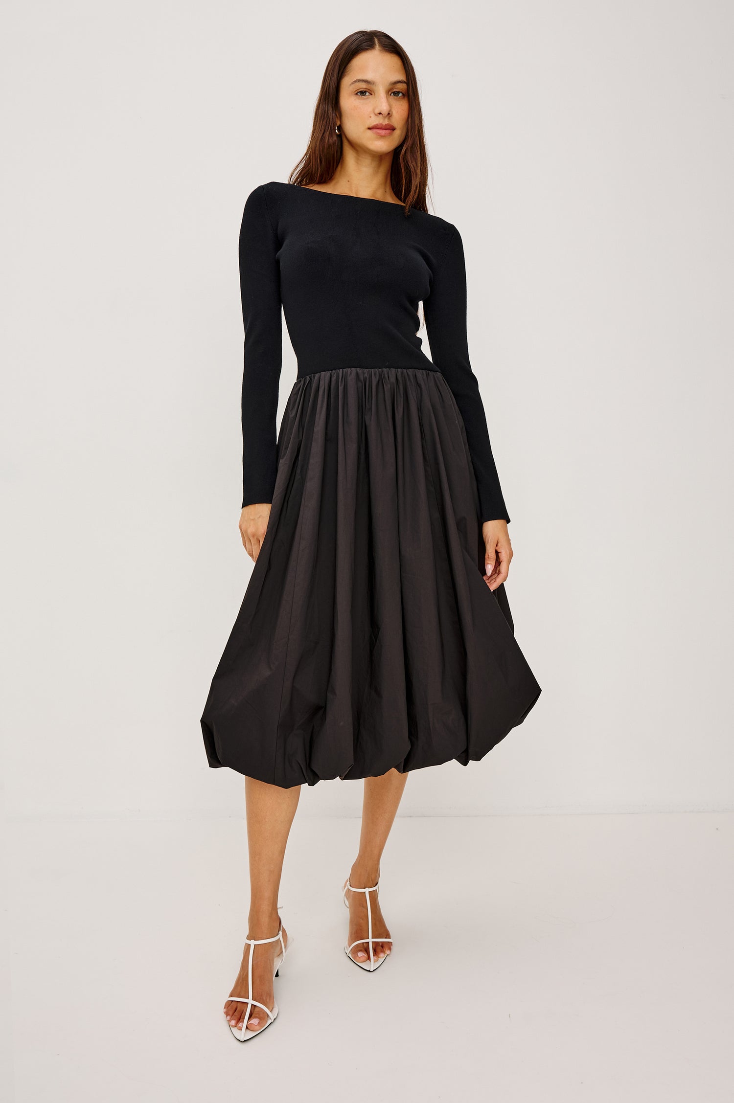 Romana Midi Dress in Fine Gauge Knit and Poplin With Fitted Upper Body, Boat Neckline, Long Sleeves, Drop Waistline, and Voluminous Bubble Skirt in Black Colorway - Full Body Front View Featured on Model