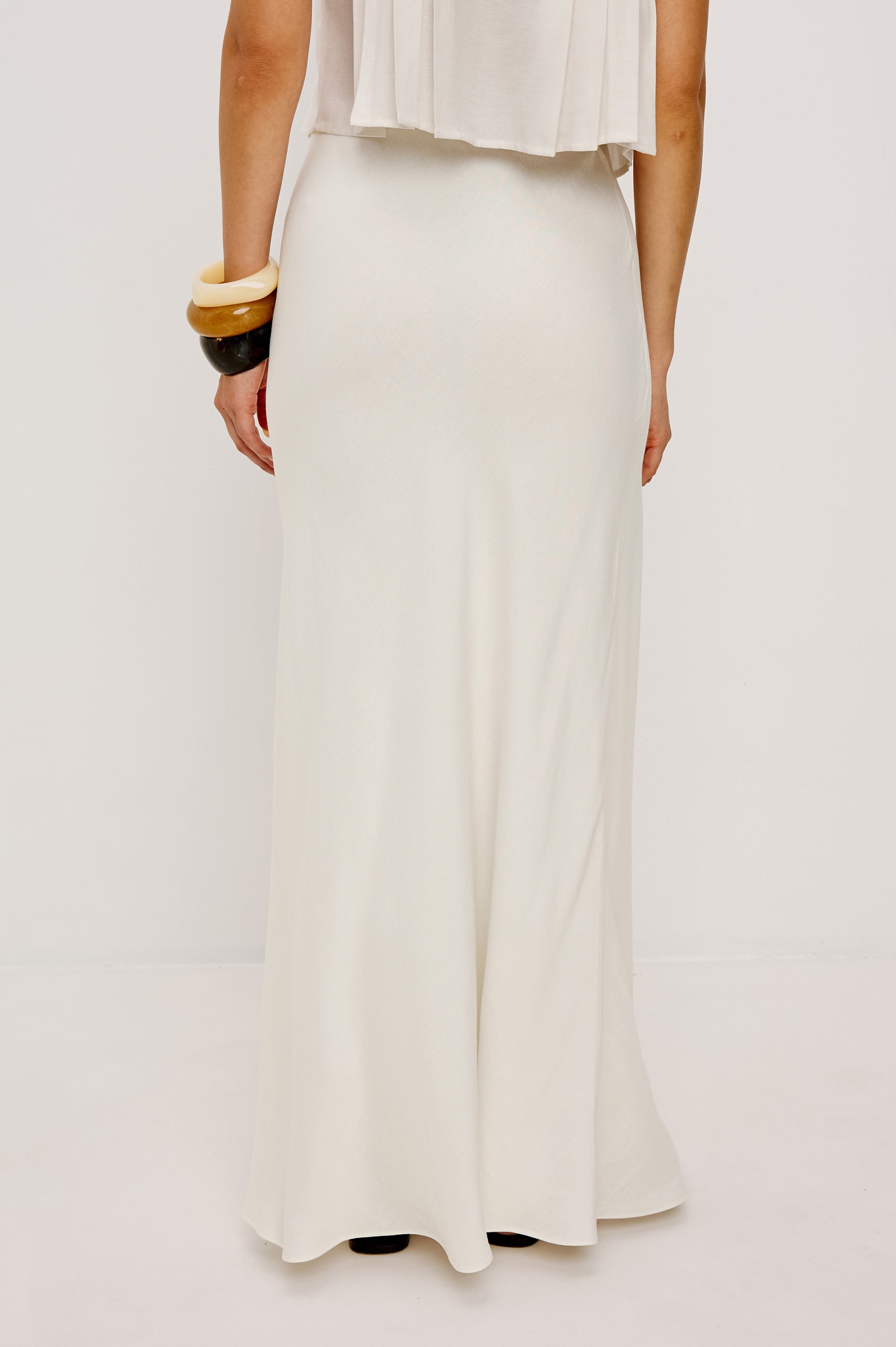 Romina High-Waisted Skirt in Linen With Elastic Waistband in Ivory Colorway - Lower Body Back View Featured on Model