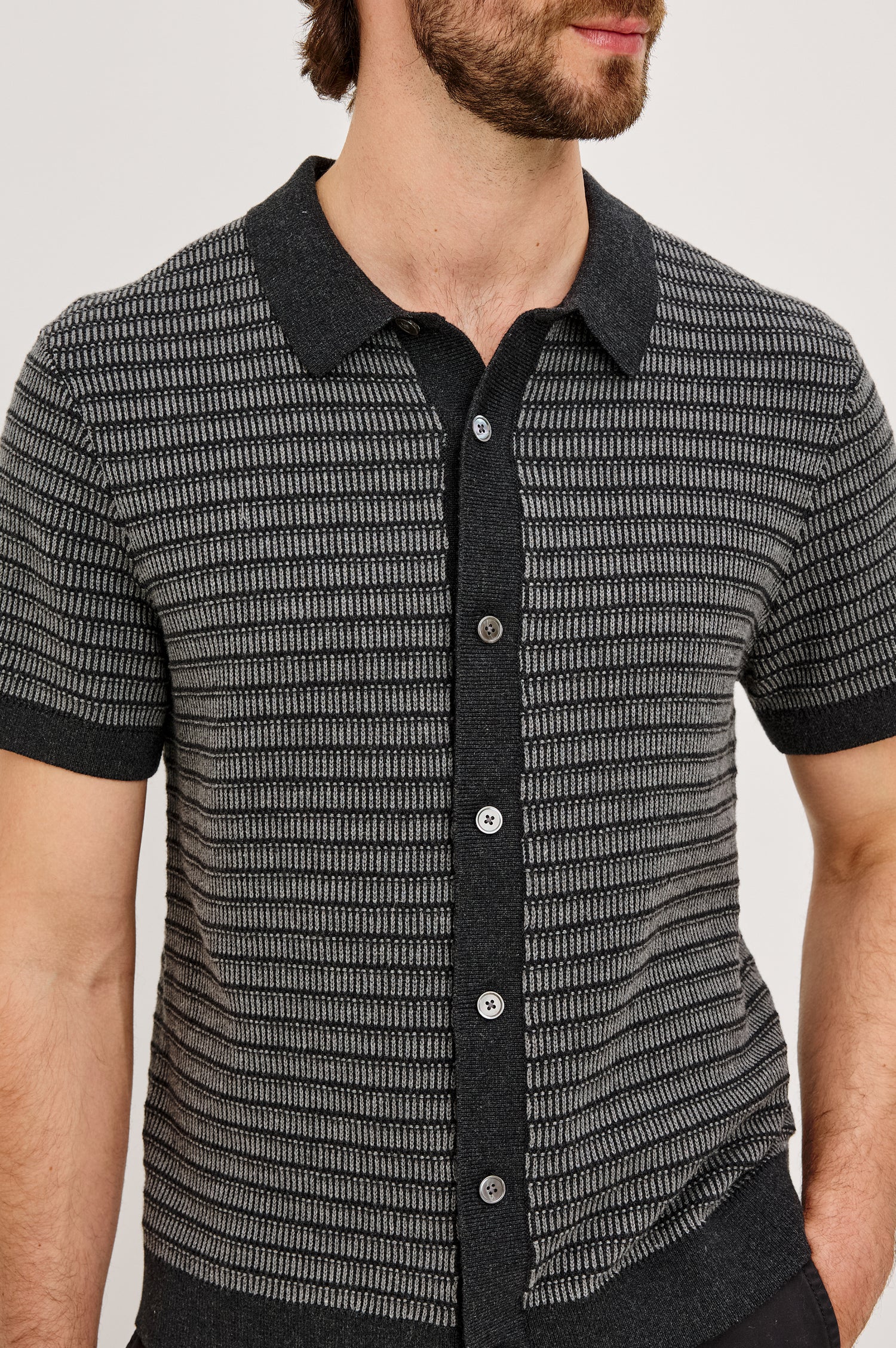 Rubin Shirt in Cotton Knit WIth Short Sleeves, Full Button Placket, Ribbed Collar, and Tonal Texture in Charcoal Black Stripe Colorway - Upper Body Front View Featured on Model