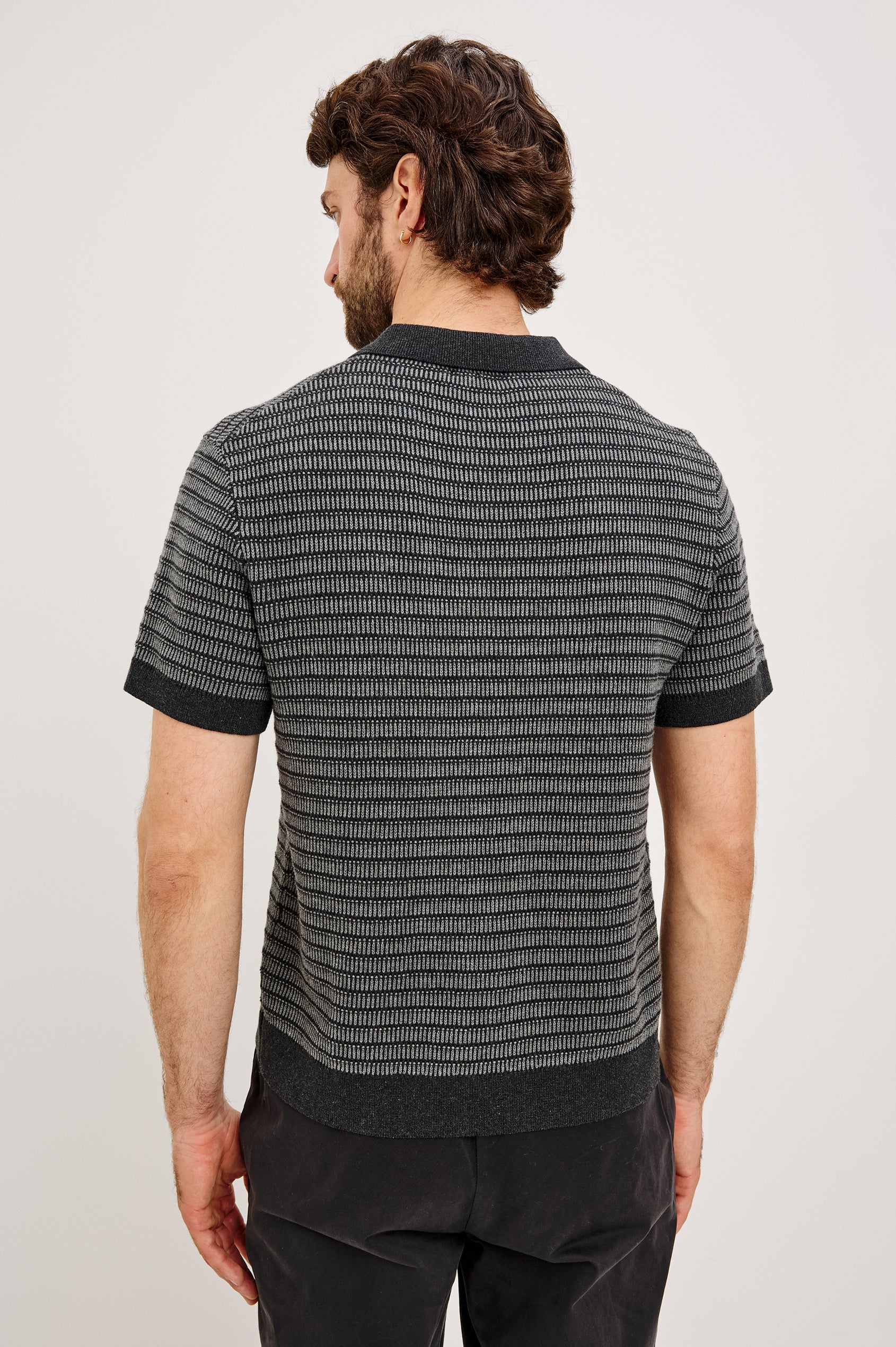 Rubin Shirt in Cotton Knit WIth Short Sleeves, Full Button Placket, Ribbed Collar, and Tonal Texture in Charcoal Black Stripe Colorway - Upper Body Back View Featured on Model