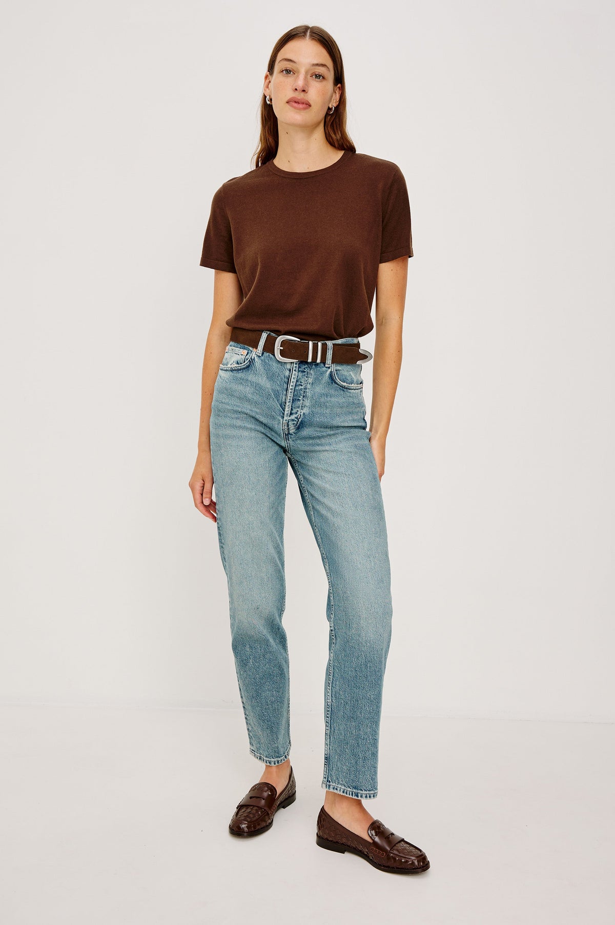 Ryder suede leather belt features silver metal hardware, a metal tip in Chocolate colorway, full body front view featured on model
