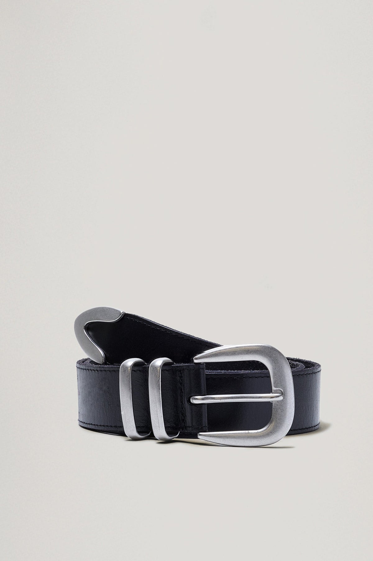 Ryder black leather belt with a brushed silver horseshoe-style buckle, matching dual loops, and a silver metal tip - front view featured on model.