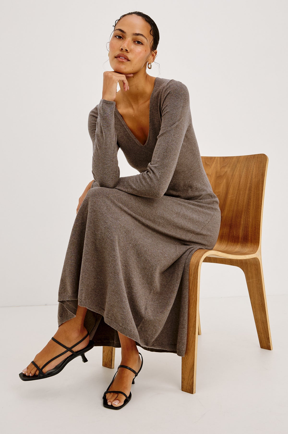 Sabrina Midi Dress in Fine Knit With Fitted Bodice, V-Neckline, Front Seam, and A-line Skirt in Heather Latte - Front Full Body View Featured on Model Sitting.