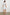 Samina Above-Knee Sleeveless Dress with drawstrings at the Sleeve Openings, Buttons along the Bodice, A Cinched Waist and a Tiered Skirt in Sonoma Stripe Colorway, Thin Vertical Blue Stripes on White - Back Full Body View Featured on Model 