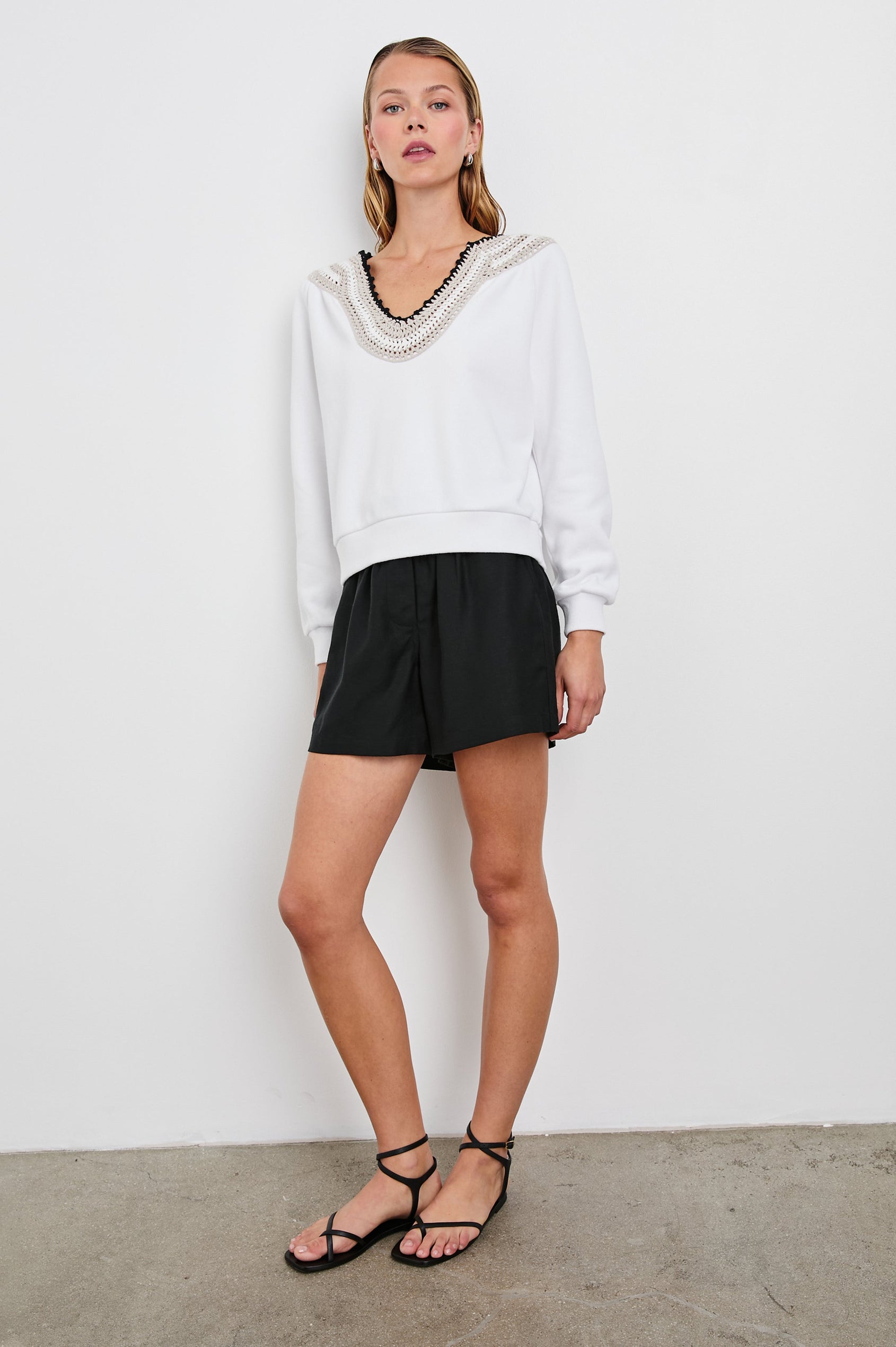 Sava Sweatshirt with V neck and Crochet along the Neckline in Ivory with Crochet Colorway, with cream, white and black crochet - Front Full Body View Featured on Model
