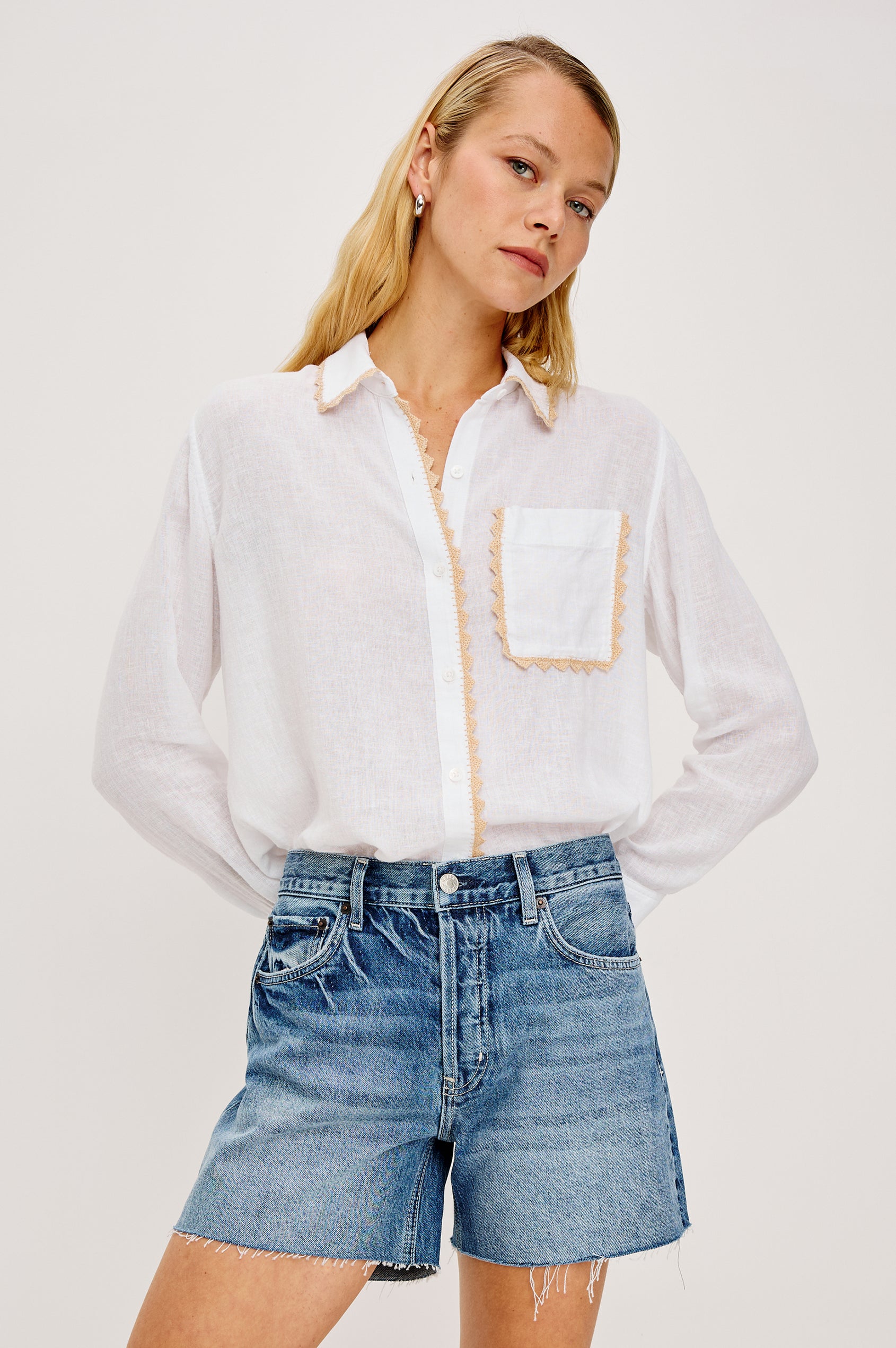 Saya Button-Up Shirt in Luxe Linen With Collar Single Chest Patch Pocket Long Sleeves Relaxed Fit and Crochet Embroidered Detailing in White Colorway - Upper Body Close Up Side View Featured on Model