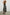 Selani Midi Dress With an Asymmetrical Neckline, Mid-Thigh Slide Slit and Cinched Waistband in Island Stripe Colorway, with alternating white and black horizontal and vertical stripes - Back Full Body View Featured on Model