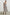 Selani Midi Dress With an Asymmetrical Neckline, Mid-Thigh Slide Slit and Cinched Waistband in Russet Floral Colorway, with white and tan flowers on russet - Front Full Body View Featured on Model