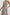 Selani Midi Dress With an Asymmetrical Neckline, Mid-Thigh Slide Slit and Cinched Waistband in Russet Floral Colorway, with white and tan flowers on russet - Front View Featured on Model