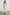 Selani Midi Dress With an Asymmetrical Neckline, Mid-Thigh Slide Slit and Cinched Waistband in White Colorway - Front Full Body View Featured on Model