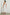 Selani Midi Dress With an Asymmetrical Neckline, Mid-Thigh Slide Slit and Cinched Waistband in White Colorway - Back Full Body View Featured on Model