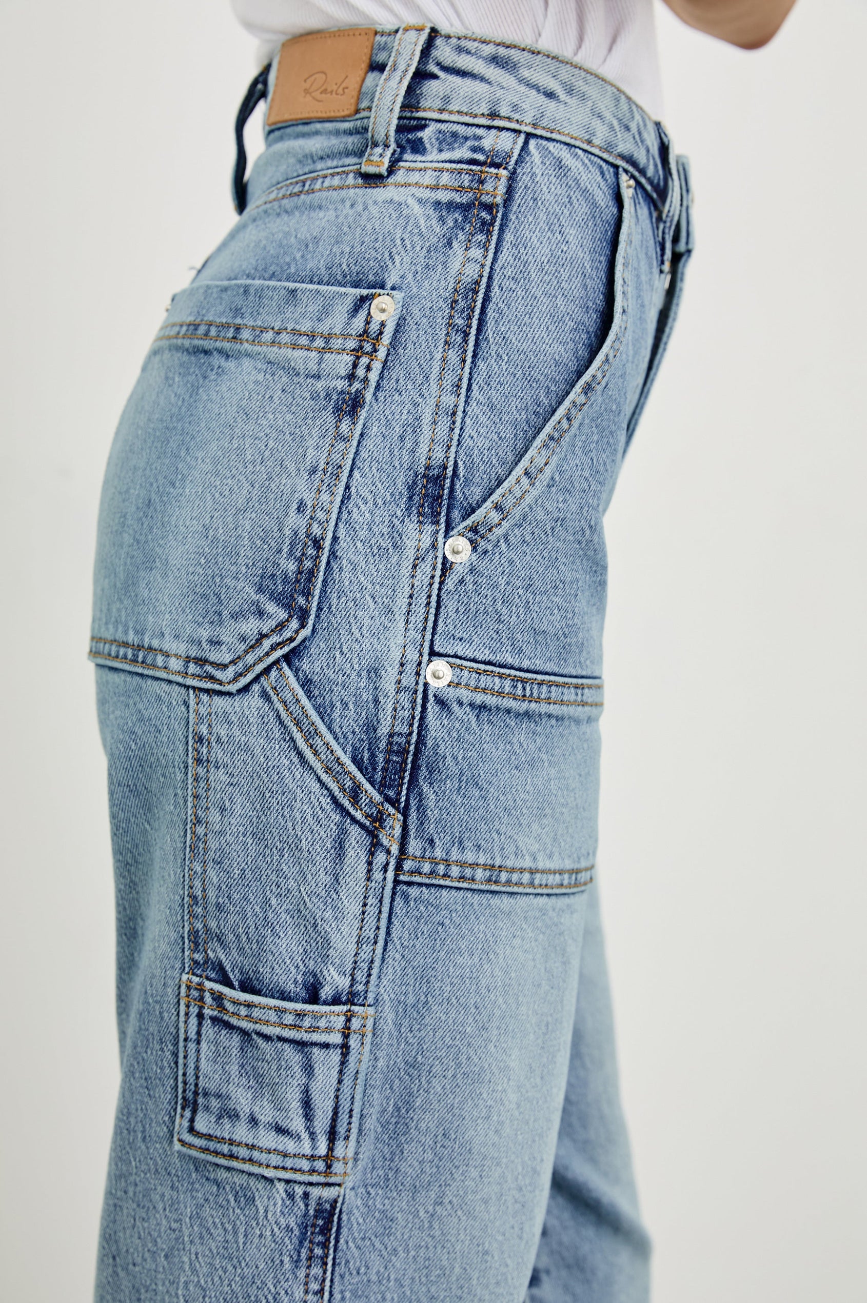 Silverado high rise wide leg crop pant with carpenter style details and contrast stitching in Blueprint - close up of side details on model