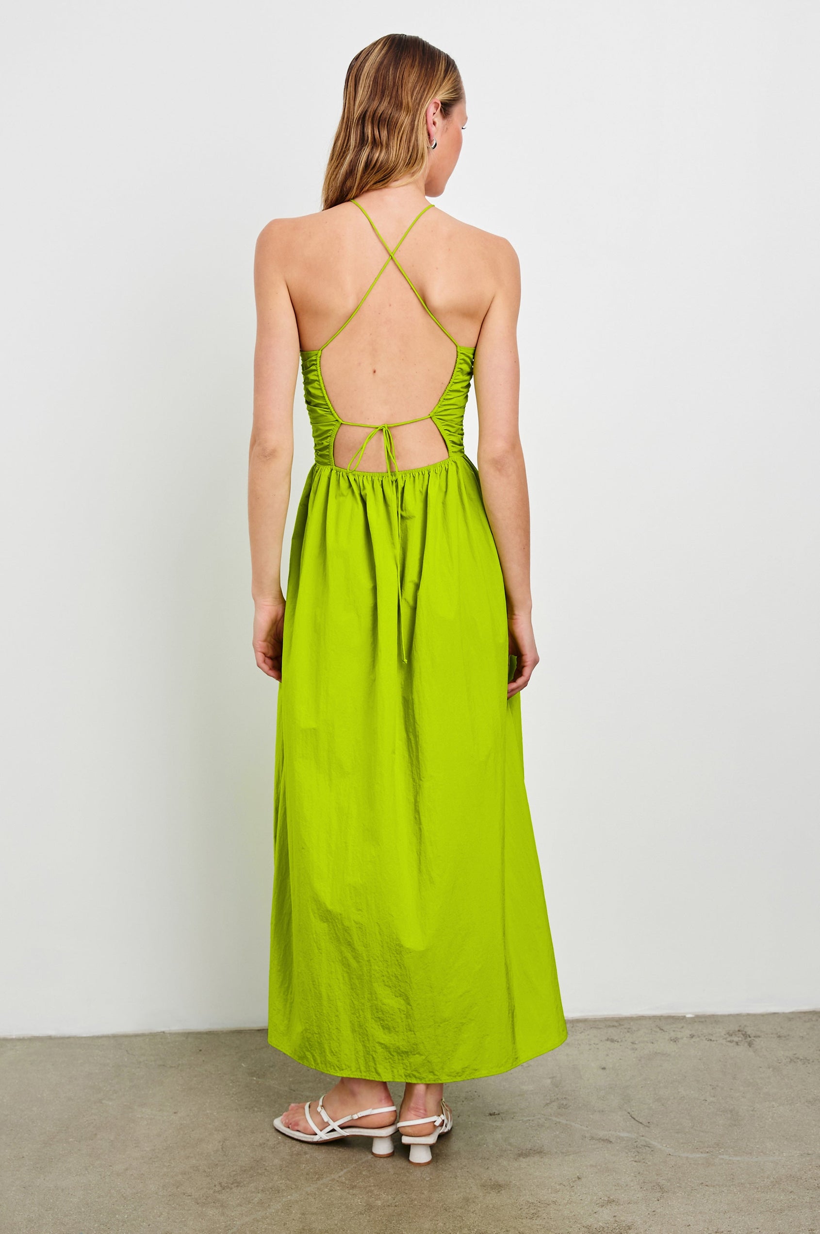 Silvia Sleeveless Maxi Dress with Spaghetti Straps with a Lower Back Tie, an Open Back, and Cutouts Along the Center of the Bodice in Banana Leaf Colorway - Back Full Body View Featured on Model