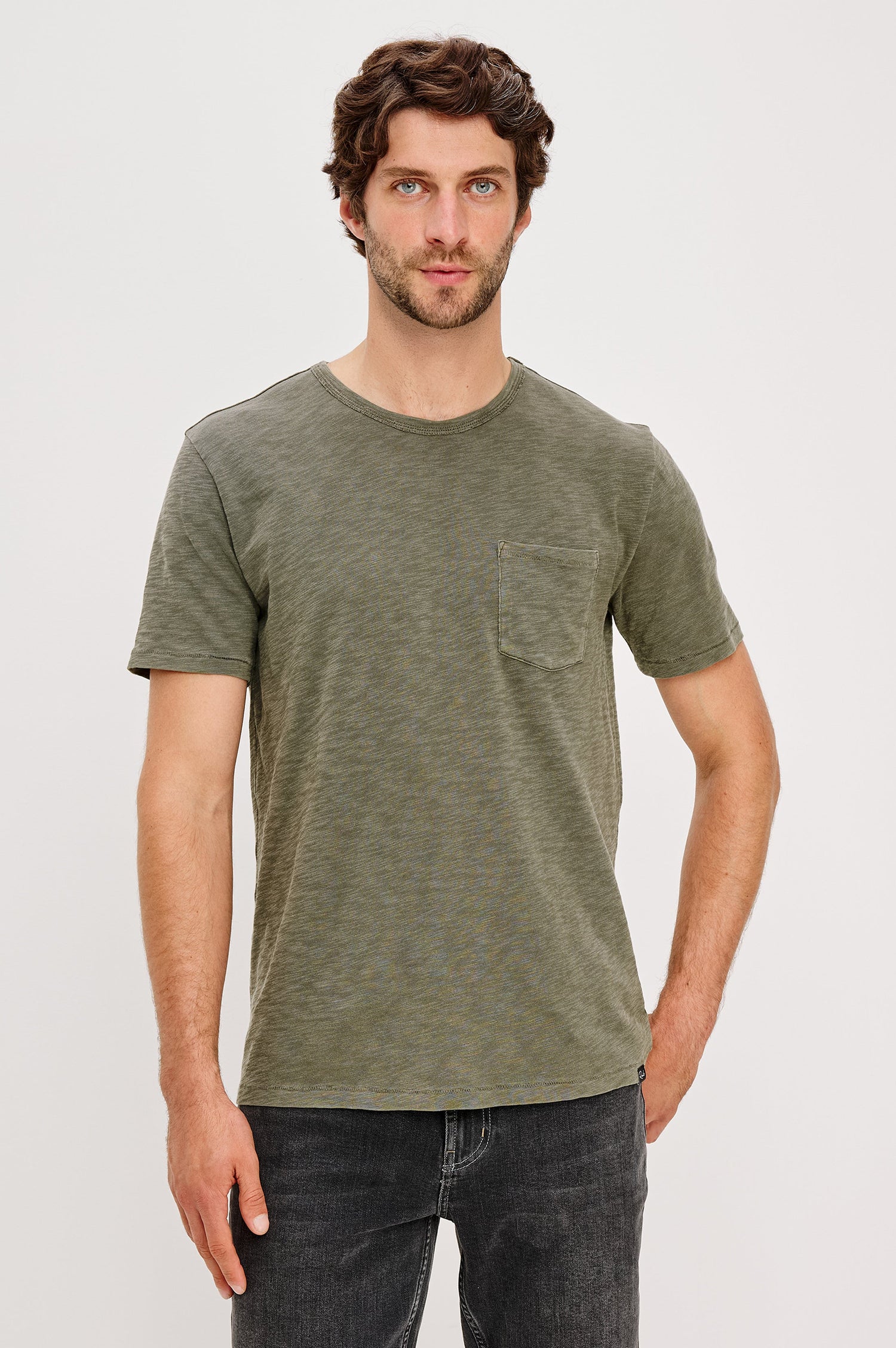 Skipper Short-Sleeve T-shirt with a Crew Neck and a Chest Patch Pocket in Surplus Colorway, a green - Front View Featured on Model