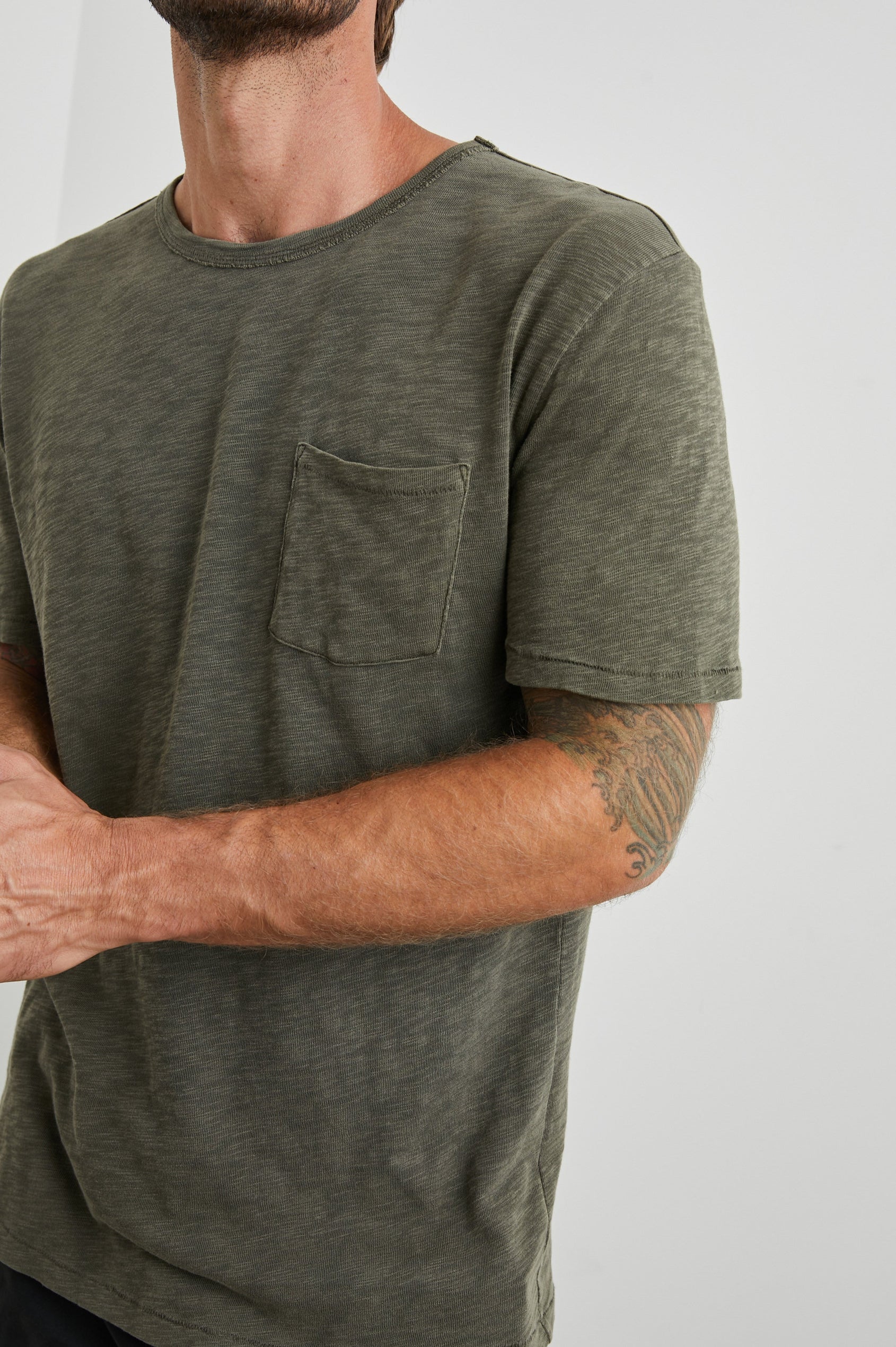 Skipper Short-Sleeve T-shirt with a Crew Neck and a Chest Patch Pocket in Surplus Colorway, a green - Front View Featured on Model