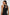Solene Sleeveless Midi Dress with a Crew Neck and a Tie Keyhole at the Back in Black Colorway - Back View Featured on Model