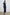 Solene Sleeveless Midi Dress with a Crew Neck and a Tie Keyhole at the Back in Navy Colorway - Back Full Body View Featured on Model