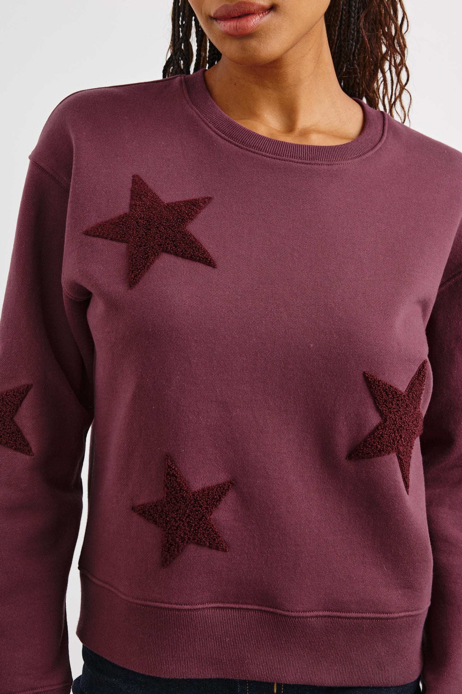 Sonia Long-Sleeve Sweatshirt with a Crew Neck and Patch Stars in Burgundy Colorway, with stars in a darker shade - Front View Featured on Model