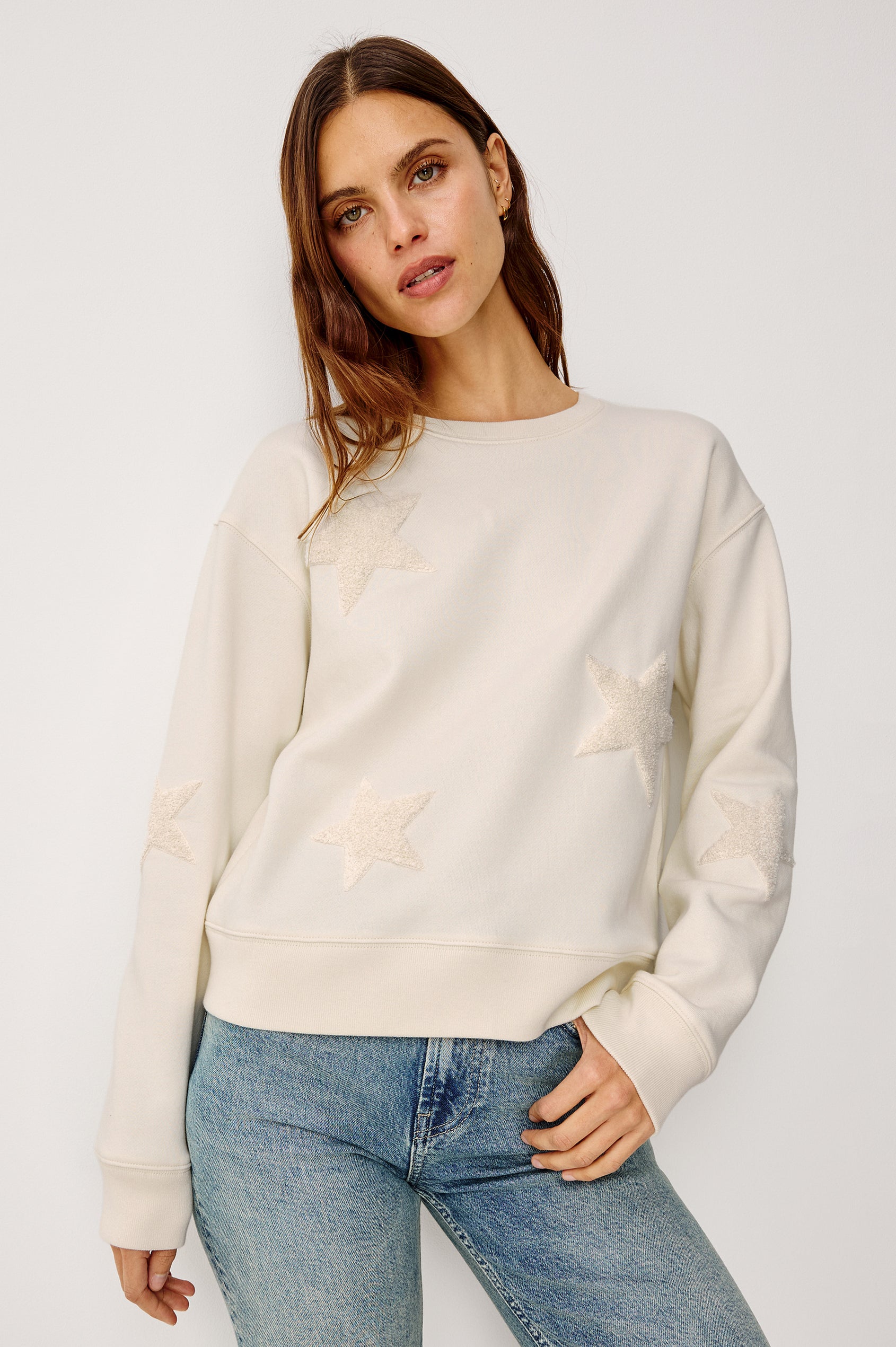 Sonia Crewneck Sweatshirt in Cotton Fleece With Flocked Stars, a Relaxed Fit, and Long Sleeves in Ivory Colorway - Upper Body Front View Featured on Model