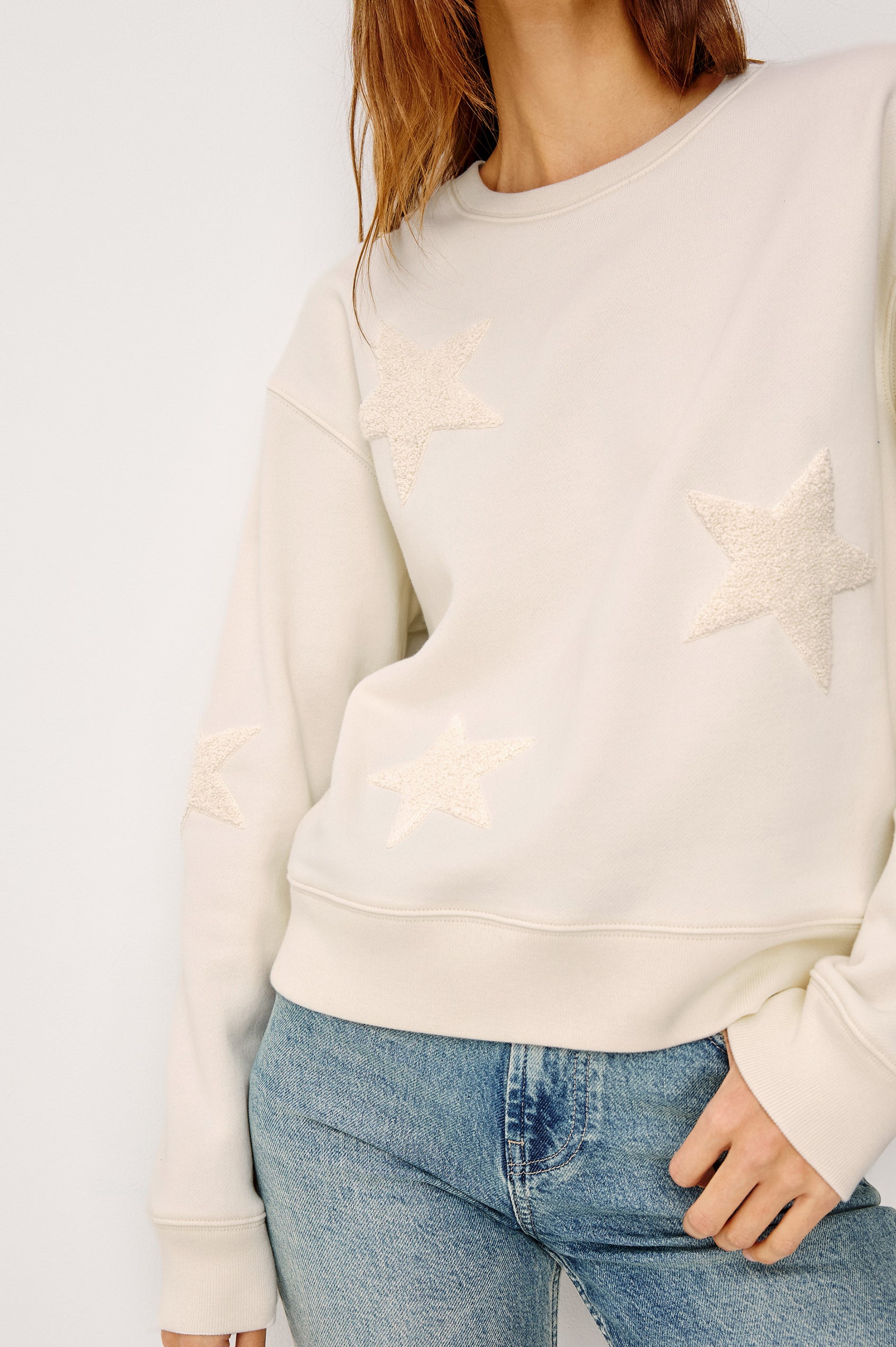 Sonia Crewneck Sweatshirt in Cotton Fleece With Flocked Stars, a Relaxed Fit, and Long Sleeves in Ivory Colorway - Upper Body Front View Featured on Model