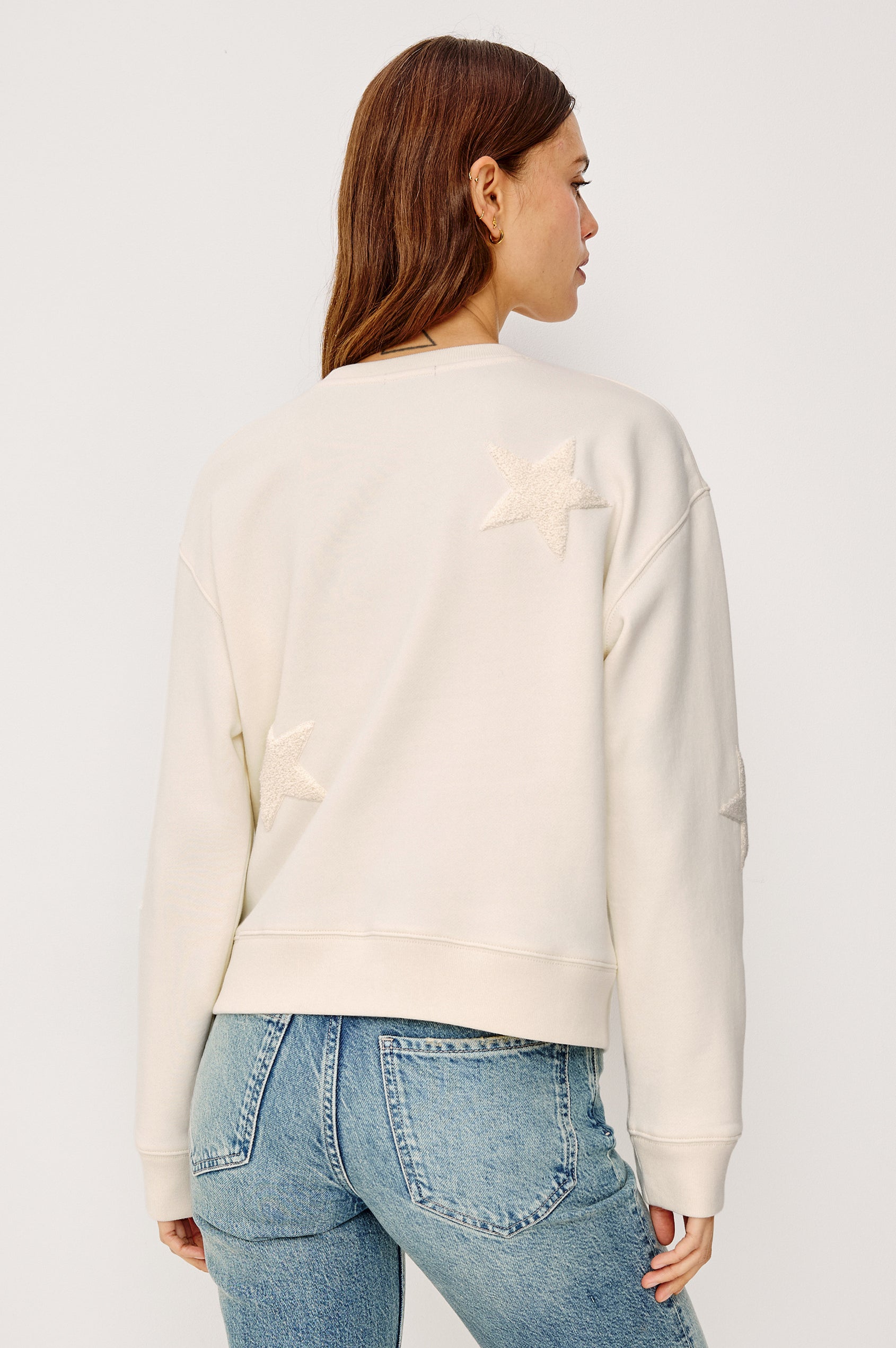 Sonia Crewneck Sweatshirt in Cotton Fleece With Flocked Stars, a Relaxed Fit, and Long Sleeves in Ivory Colorway - Upper Body Back View Featured on Model