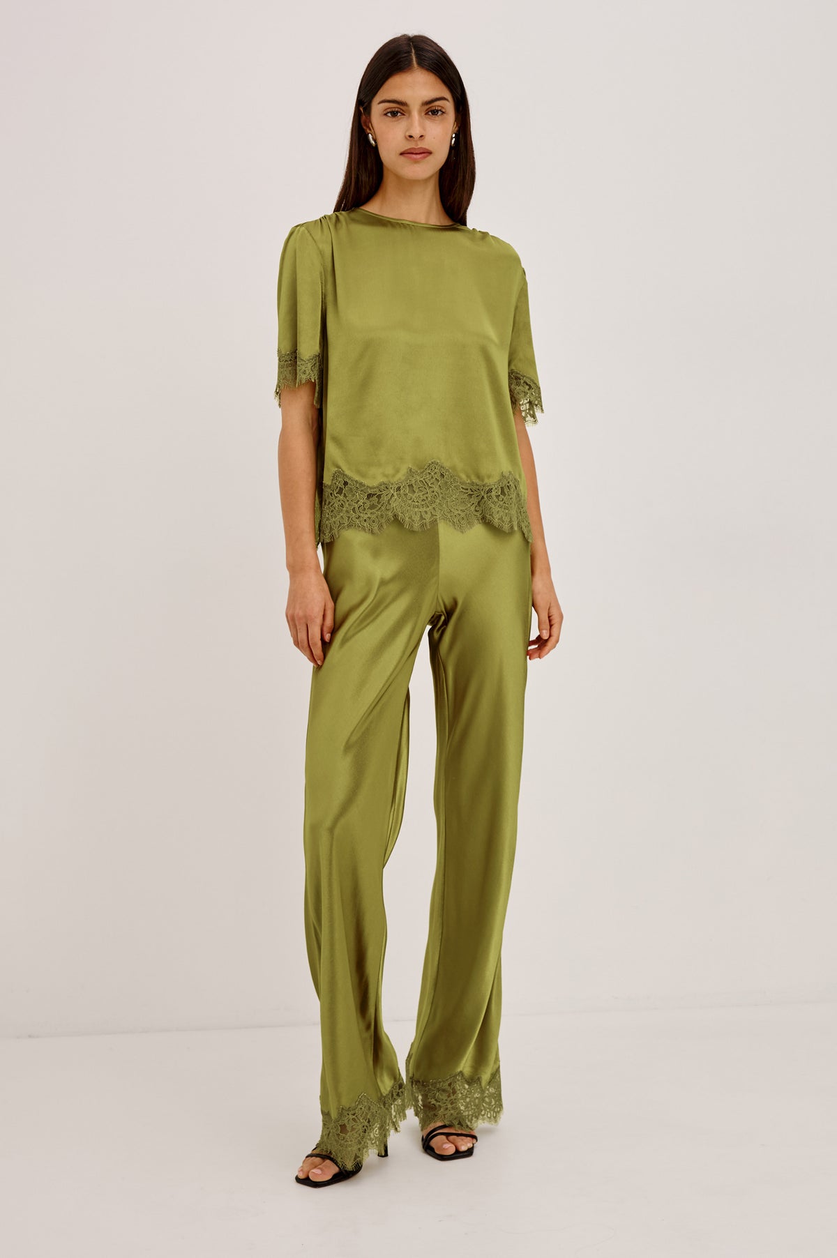 Sonora Shirt in Satin Blend With Loose Boxy Fit, Crew Neck, Shirred Shoulders, Short Sleeves, Button-Loop Back Keyhole, and Lace Trim in Celery ColorwayFull Body Front View Featured on Model.