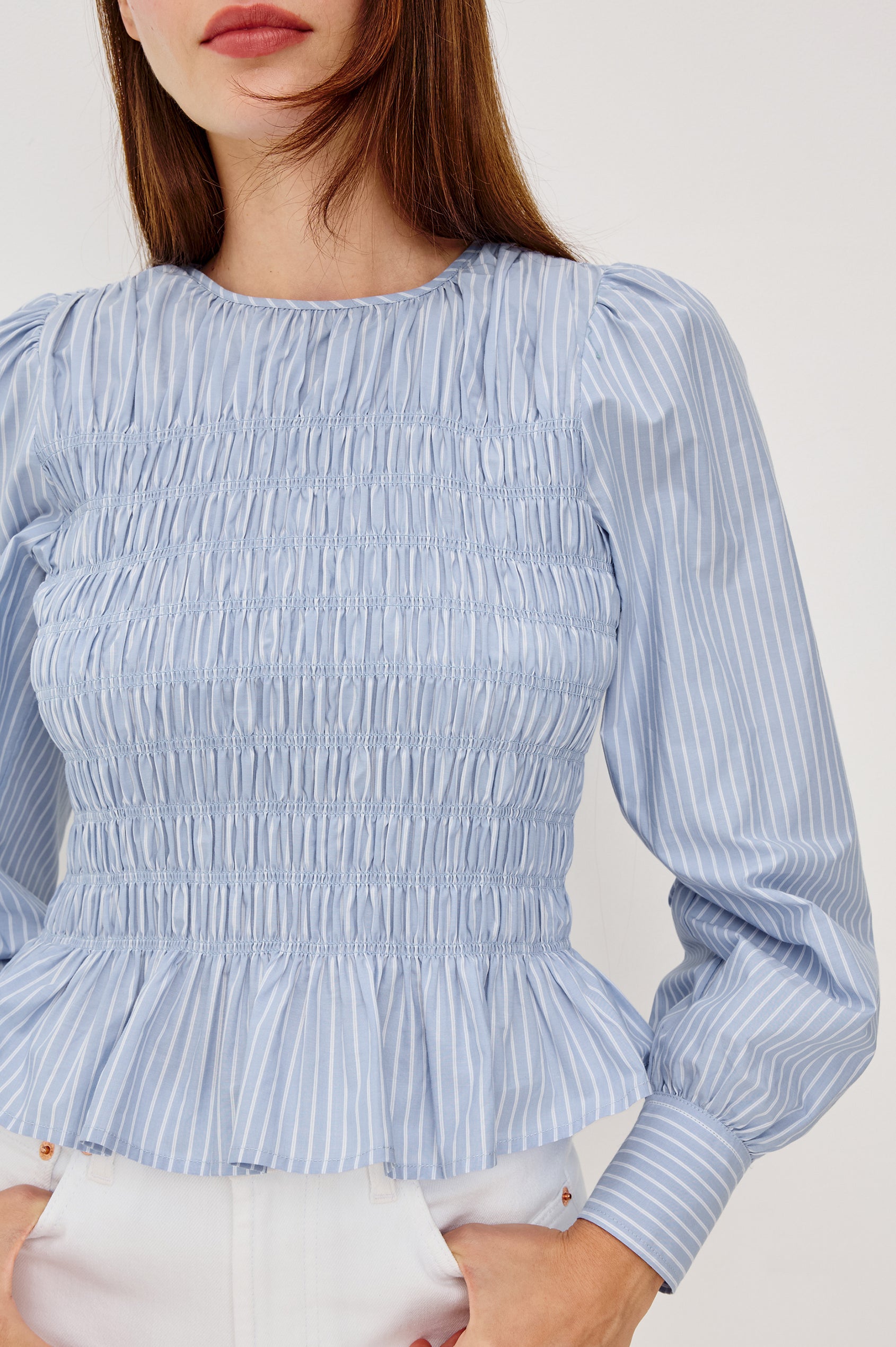 Tabi Blouse Top in Poplin With Smocked Body Long Puff Sleeves With Fitted Cuffs Contrast Embroidered Detailing and Back Keyhole Cutout in White Stripe Colorway - Upper Body Front View Featured on Model