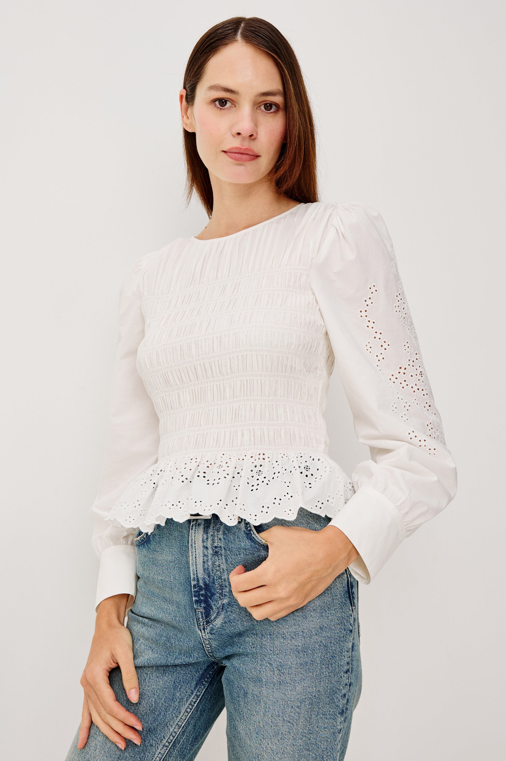Tabi Blouse Top in Poplin With Smocked Body, Long Puff Sleeves With Fitted Cuffs, Embroidered Detailing, and Back Keyhole Cutout in White Embroidery Colorway - Upper Body Front View Featured on Model