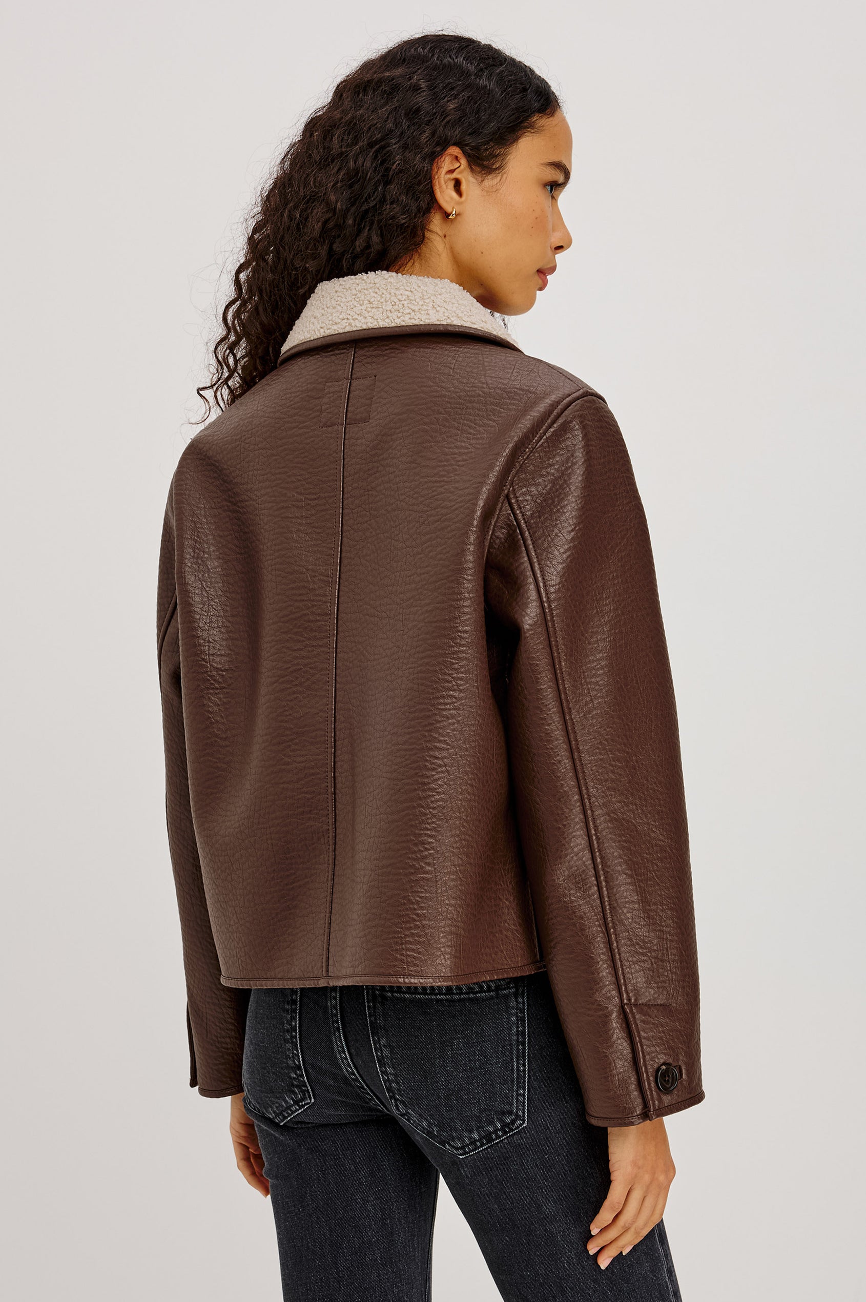 Terra Jacket in Pebbled Vegan Leather With Vegan Shearling Collar and Lining, Slightly Cropped Fit, Front Buttons, and Patch Pockets in Espresso Colorway - Upper Body Back View Featured on Model