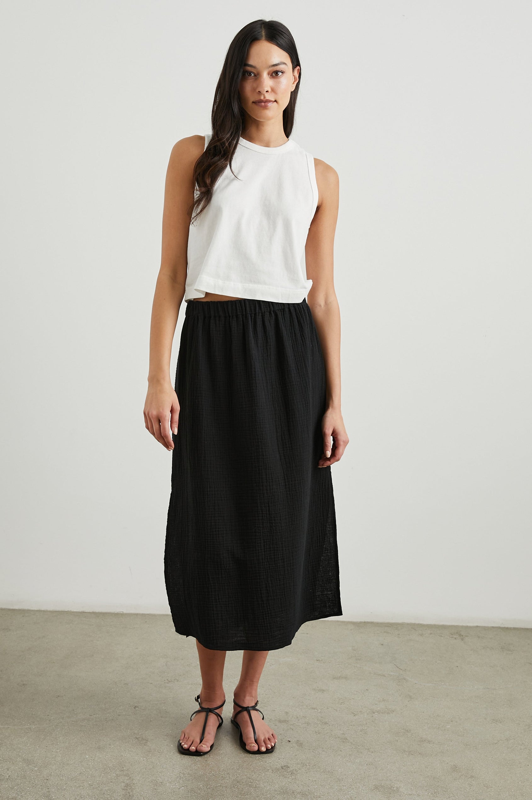 The Boxy Cropped Tank with a Crew Neck in White Colorway - Front Full Body View Featured on Model