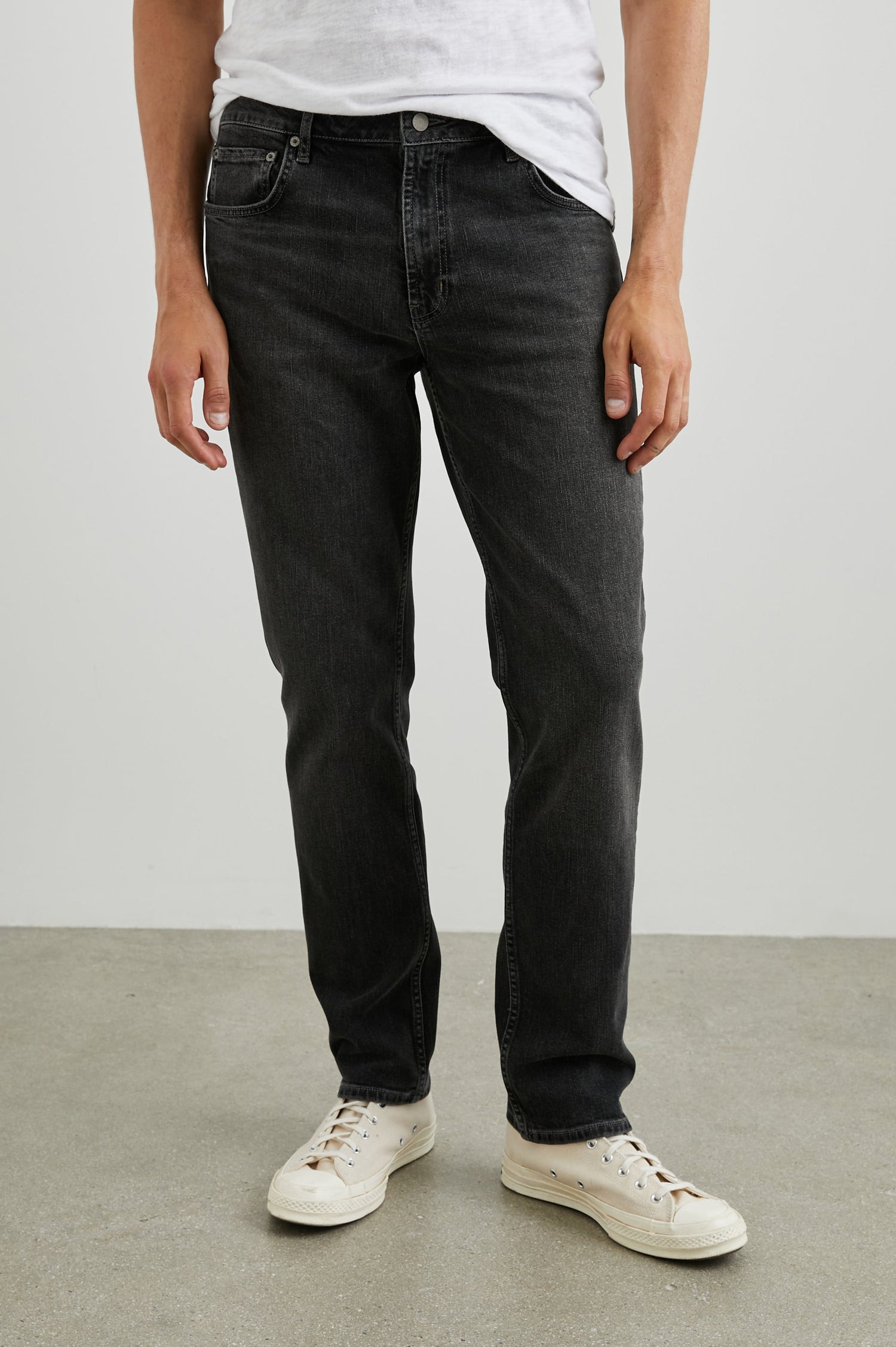 Clayton Slim Straight Jeans with Belt Loops, Two Front Pockets plus a Coin Pocket and Two Back Patch Pockets in Reever 5 Year Colorway, a Washed Black - Front View Featured on Model