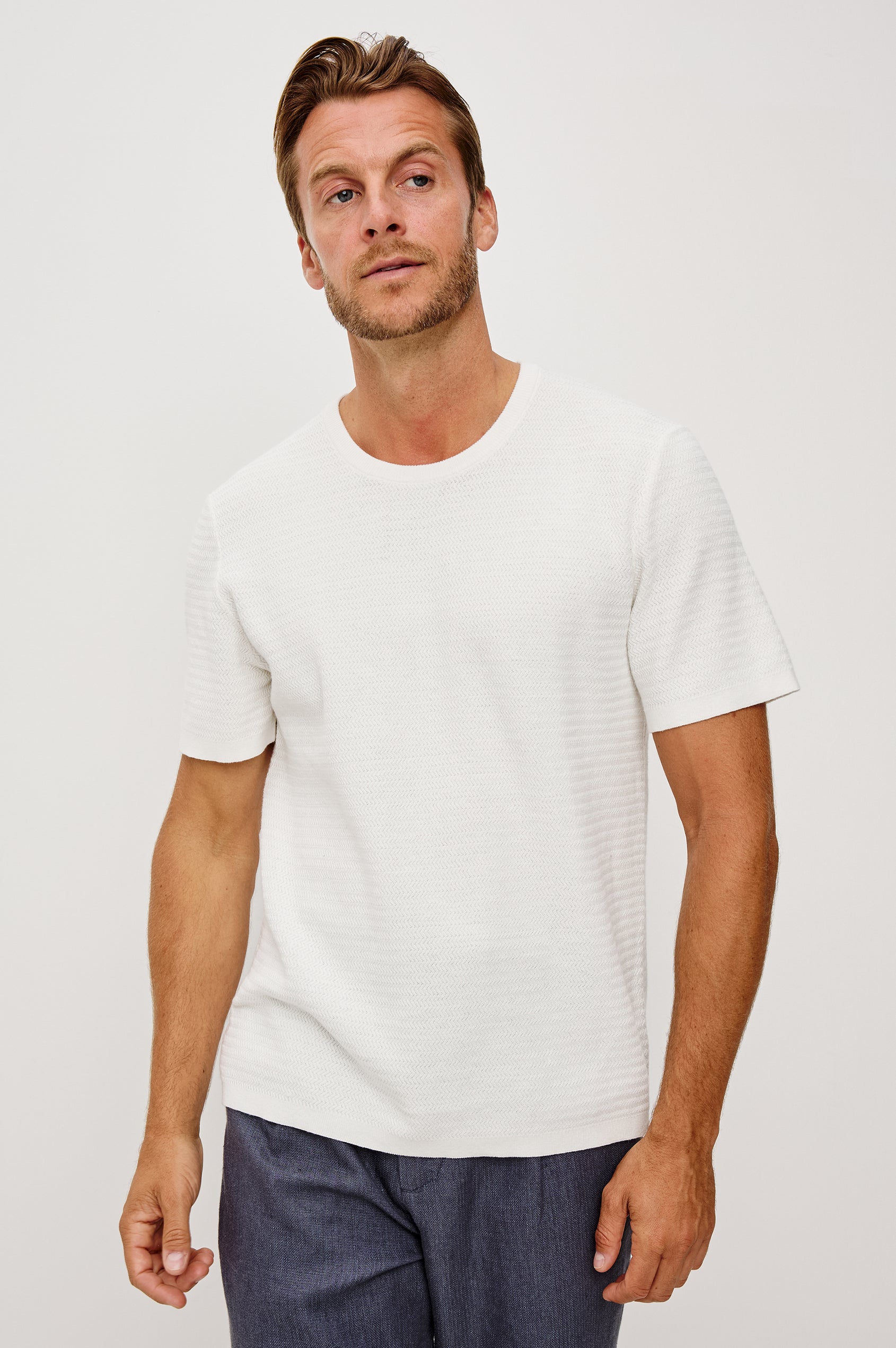 Theo T-Shirt in Ribbed Cotton-Cashmere With Crew Neckline, Short Sleeves, and Classic Fit in Porcelain Colorway - Upper Body Front View Featured on Model