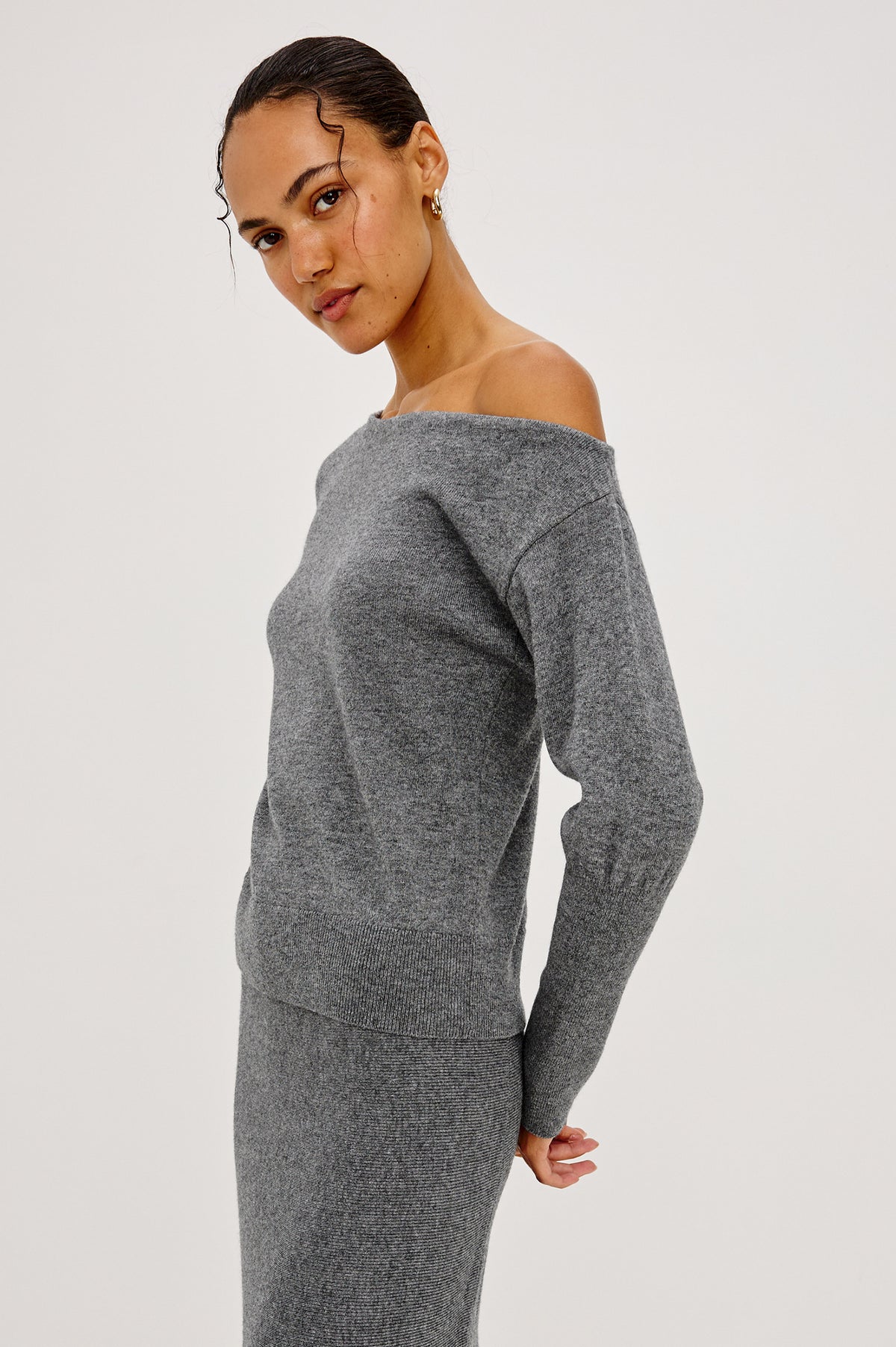 Tianna Sweater in Wool Blend With Off-Shoulder Neckline and Long Sleeves in Heather Charcoal Colorway - Front Crop View Featured on Model.