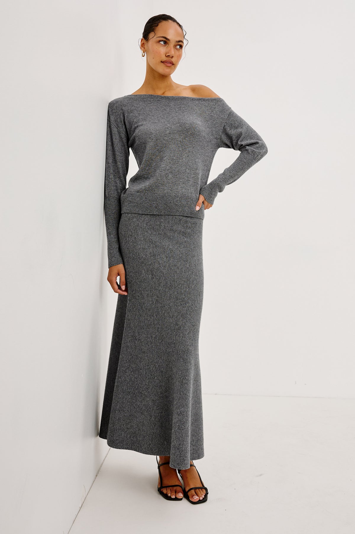 Tianna Sweater in Wool Blend With Off-Shoulder Neckline and Long Sleeves in Heather Charcoal Colorway - Front Full Body View Featured on Model.
