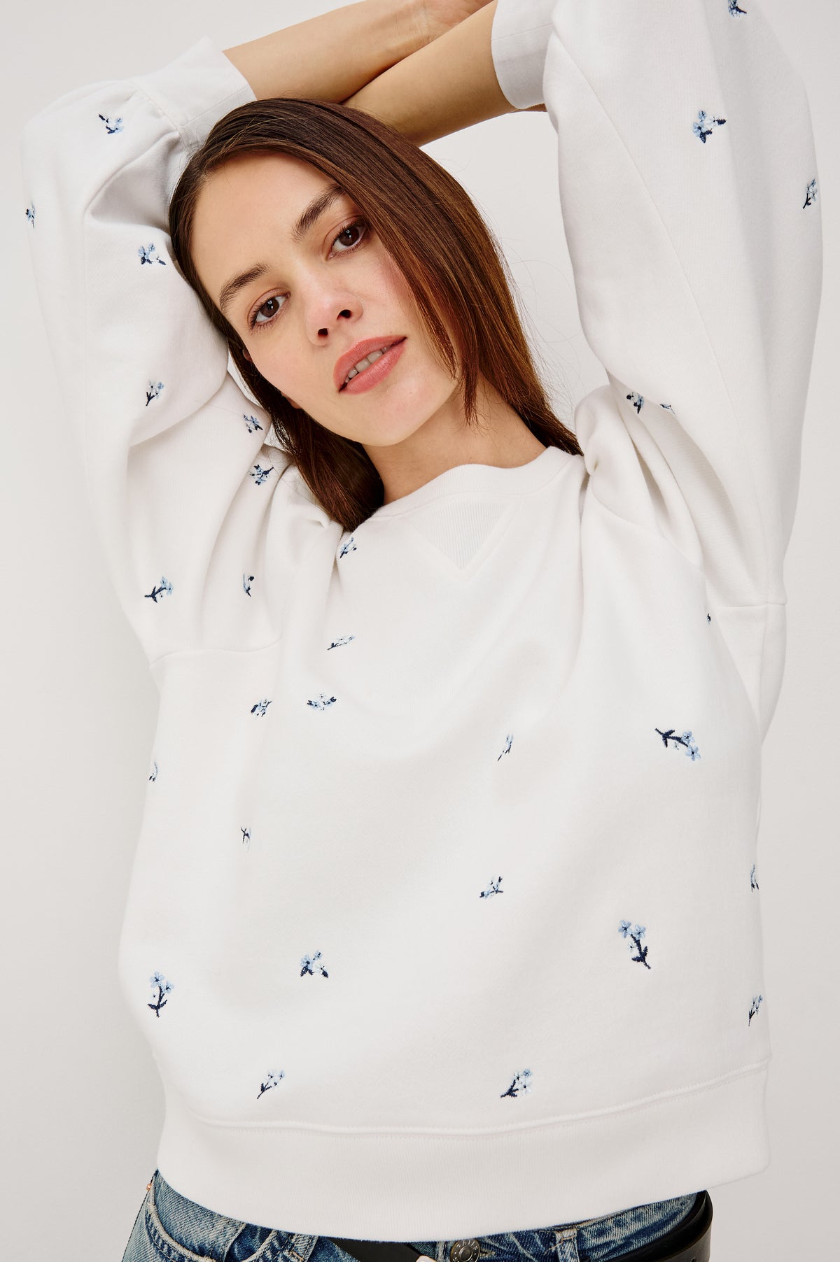 Tiffany Crewneck Sweatshirt in French Terry With Contrast Floral Embroidery, Long Puff Sleeves With Fitted Cuffs, and Ribbed Trim in Blue Iris Colorway - Upper Body Front View Featured on Model
