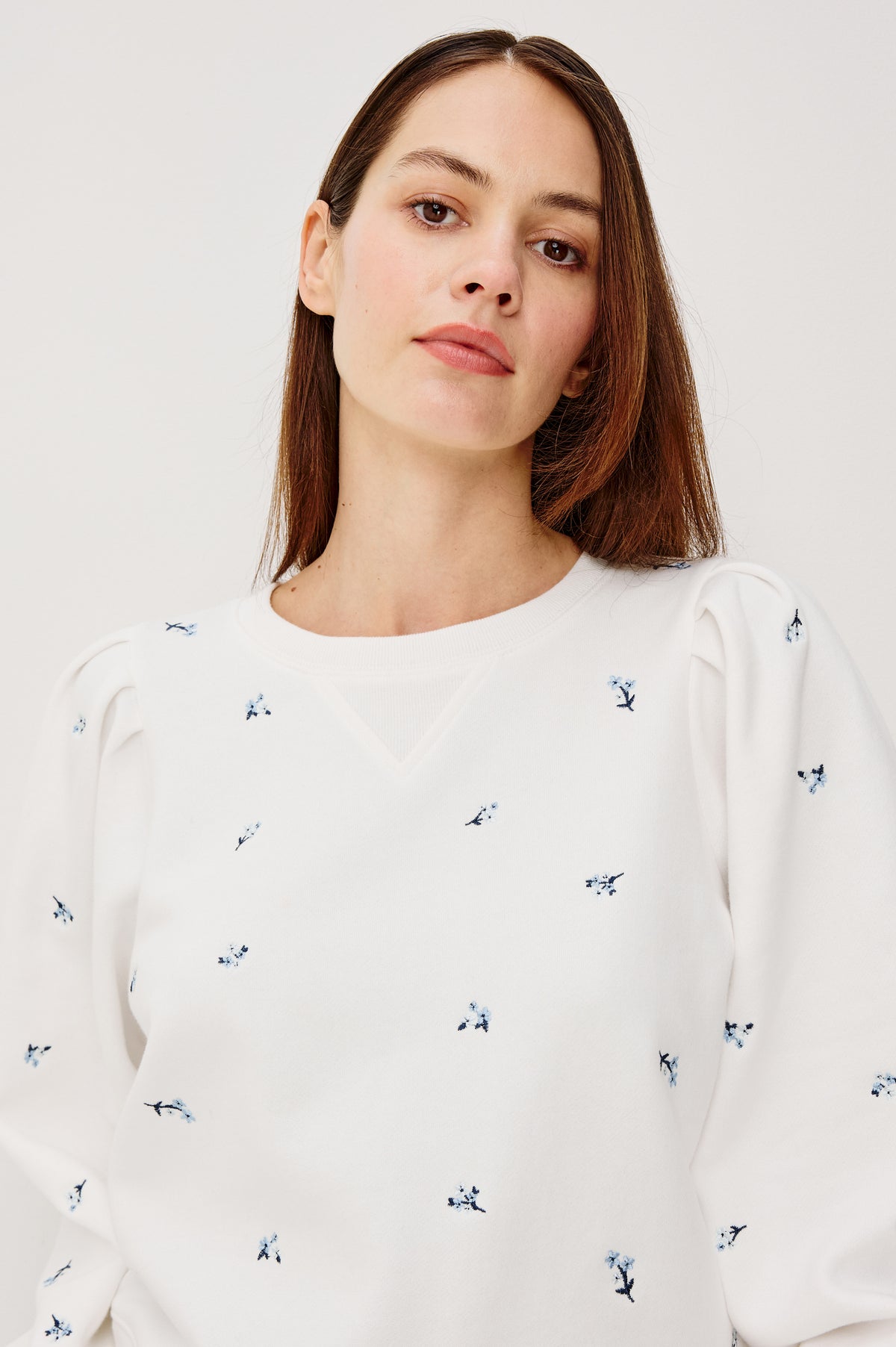 Tiffany Crewneck Sweatshirt in French Terry With Contrast Floral Embroidery, Long Puff Sleeves With Fitted Cuffs, and Ribbed Trim in Blue Iris Colorway - Upper Body Front View Featured on Model