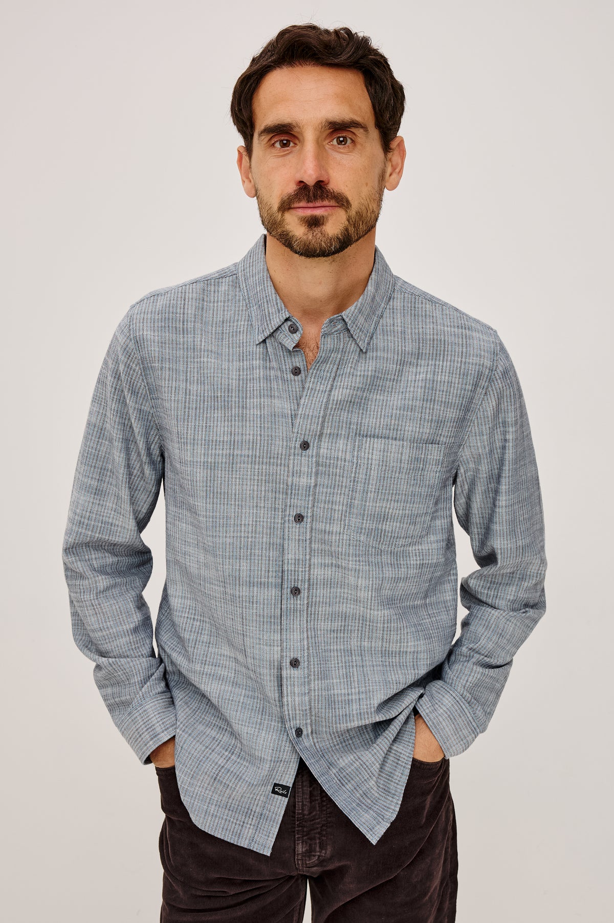 Tristan Shirt in 100% Cotton With Rope-Dyed Washed Effect, Collar, Chest Patch Pocket, Front Button Closure, and Long Sleeves in Marine Kelp Stripe Colorway - Upper Body Front View Featured on Model